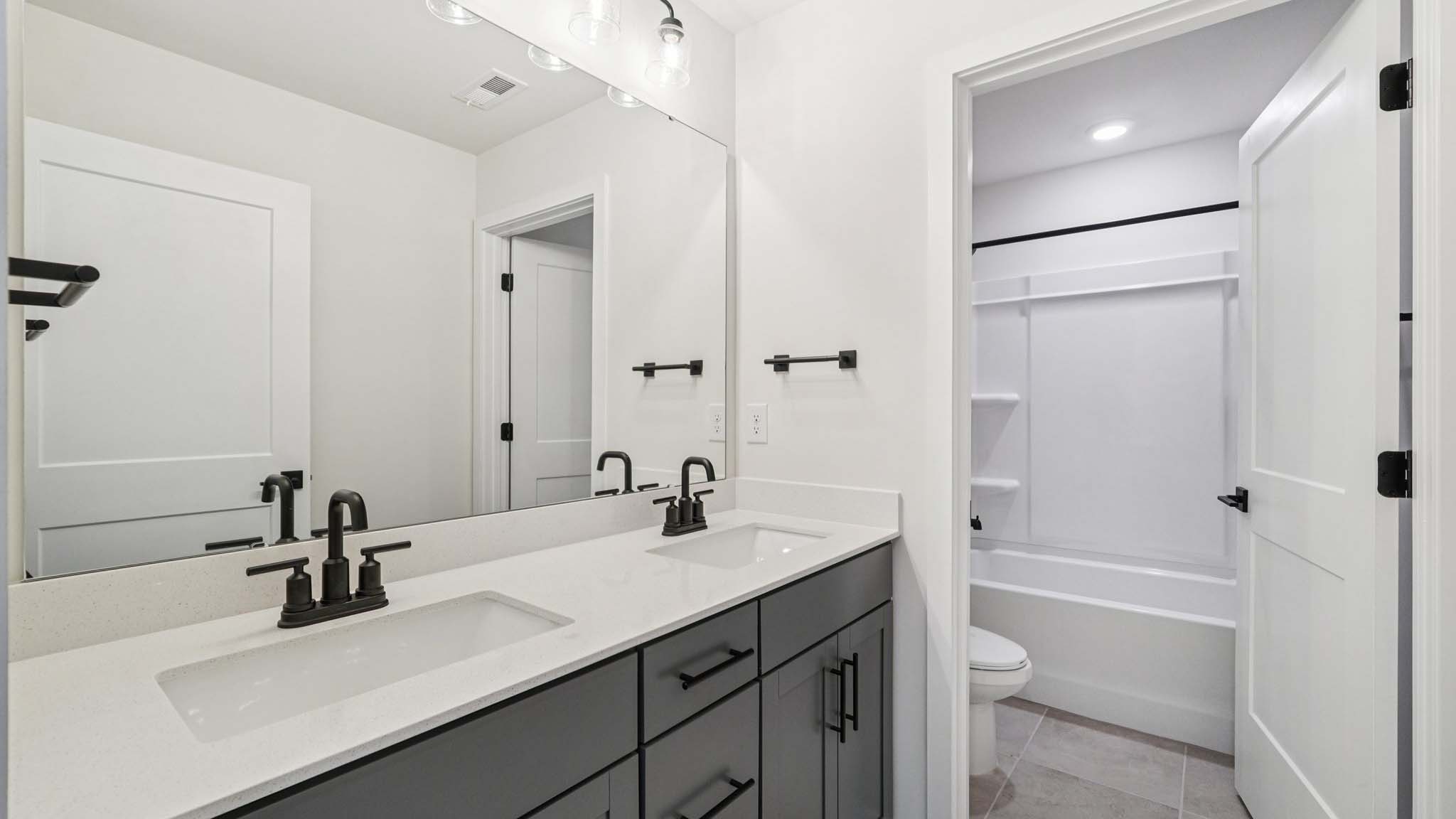 bathroom with bathtub and shower combination