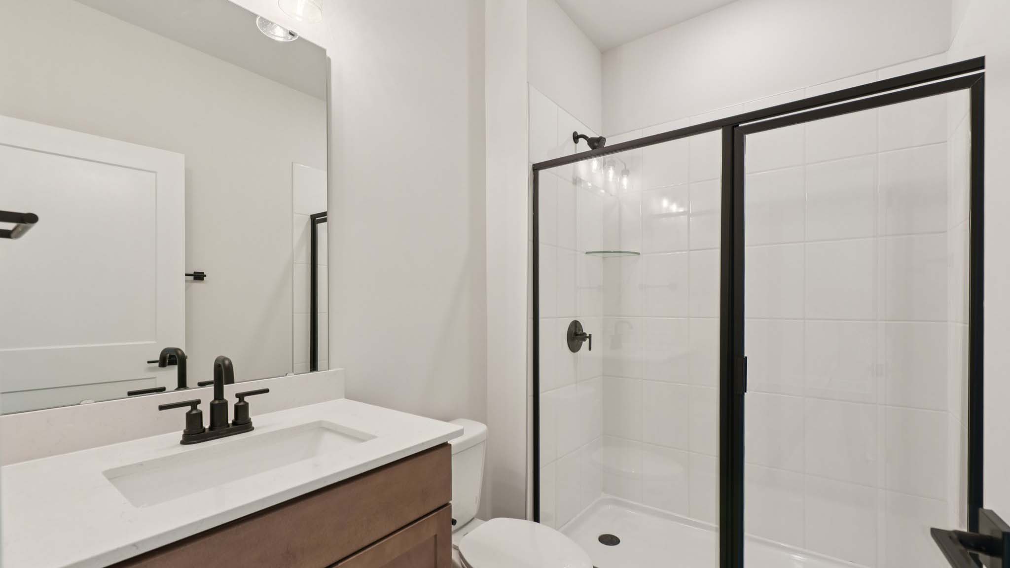Bathroom with standing glass shower