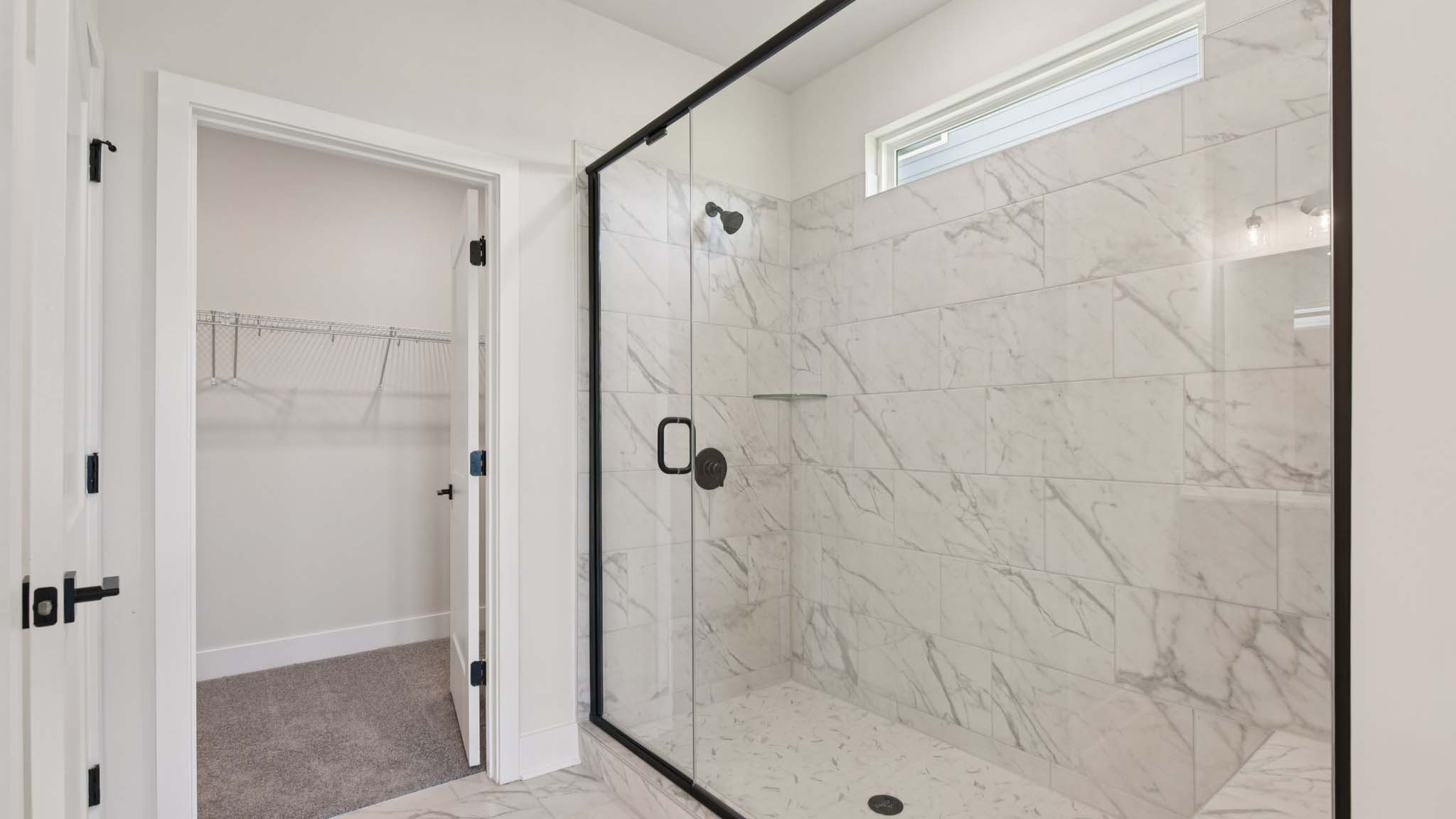 Primary bathroom with standing glass shower