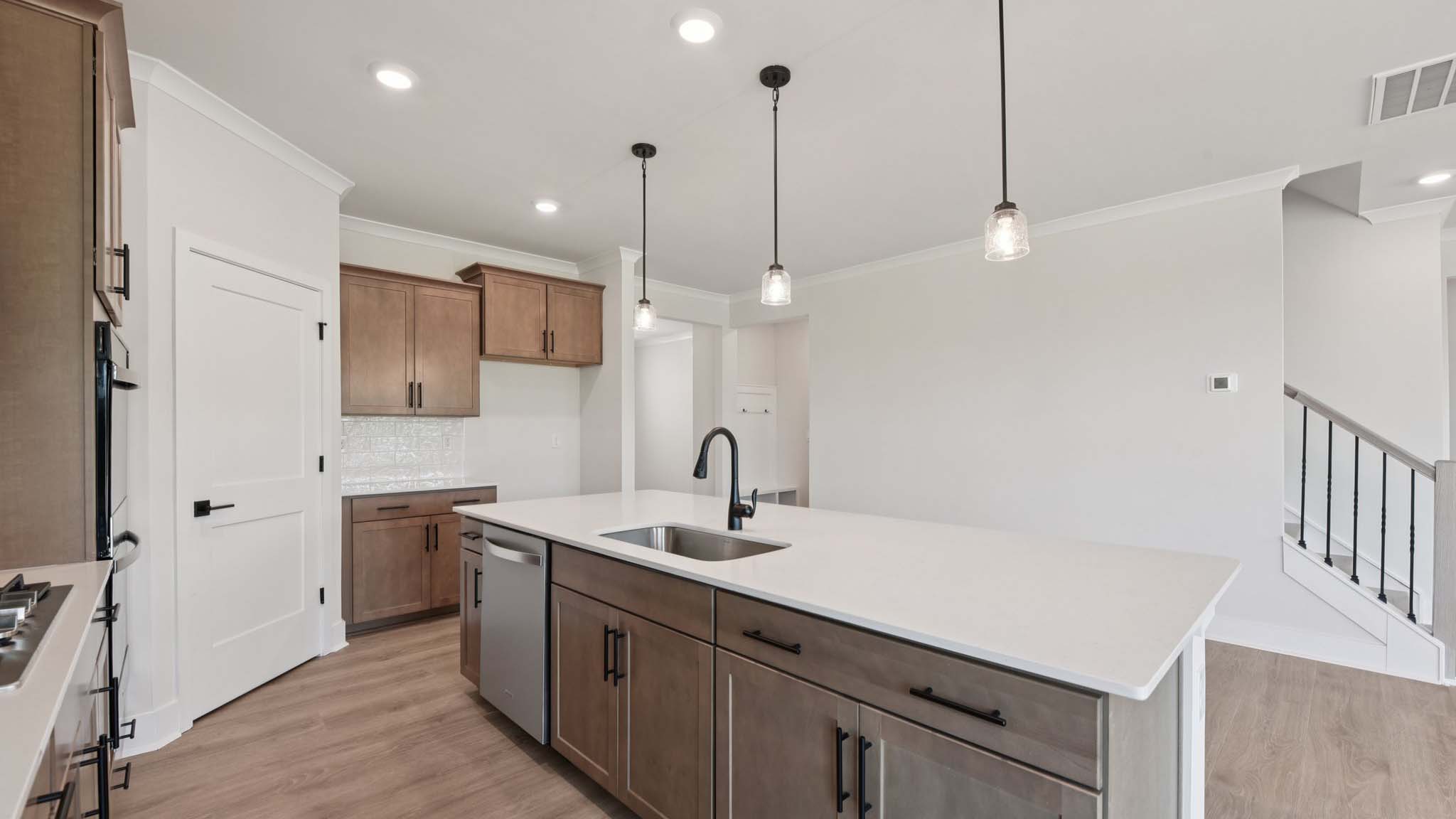 Large kitchen and island with stainless steel appliances