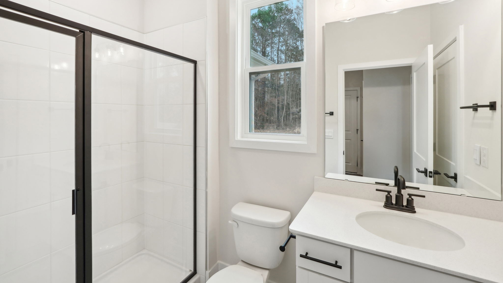bathroom with standing glass shower