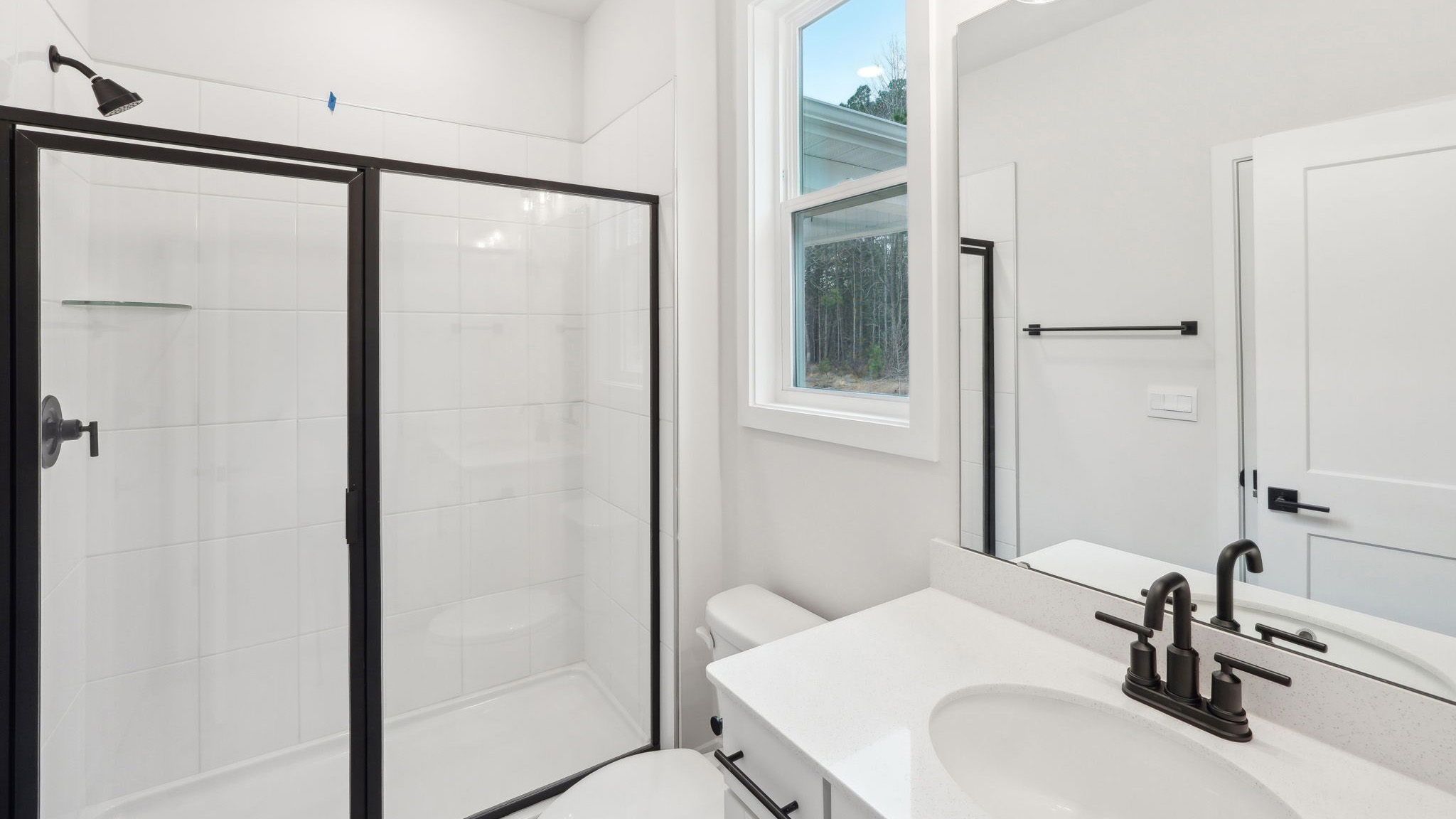 bathroom with standing glass shower