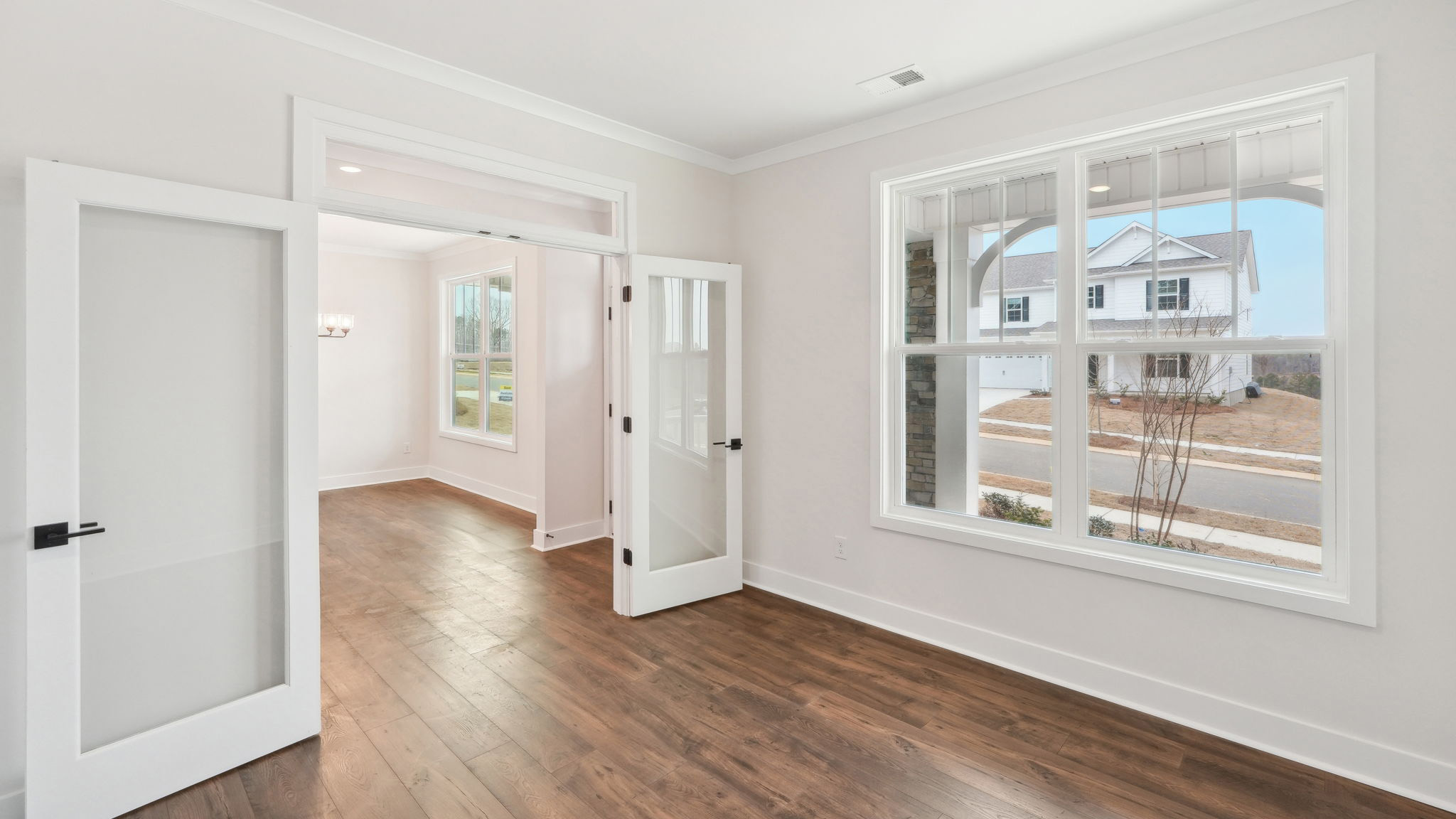 office flex space off of foyer with large window and french doors