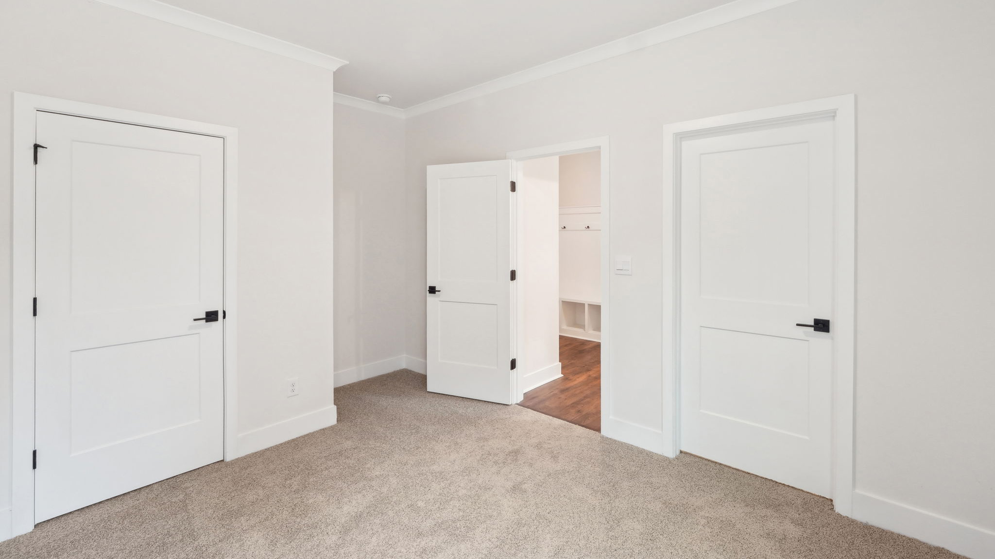 carpeted bedroom with large window