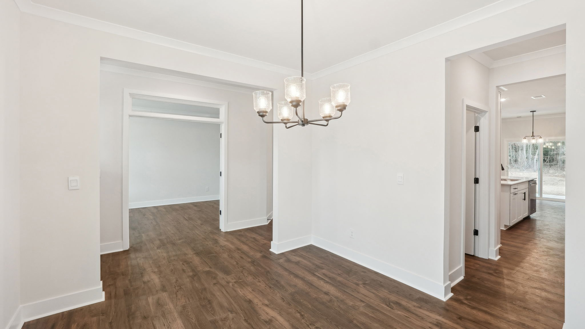 breakfast nook off of kitchen with glass sliding back doo