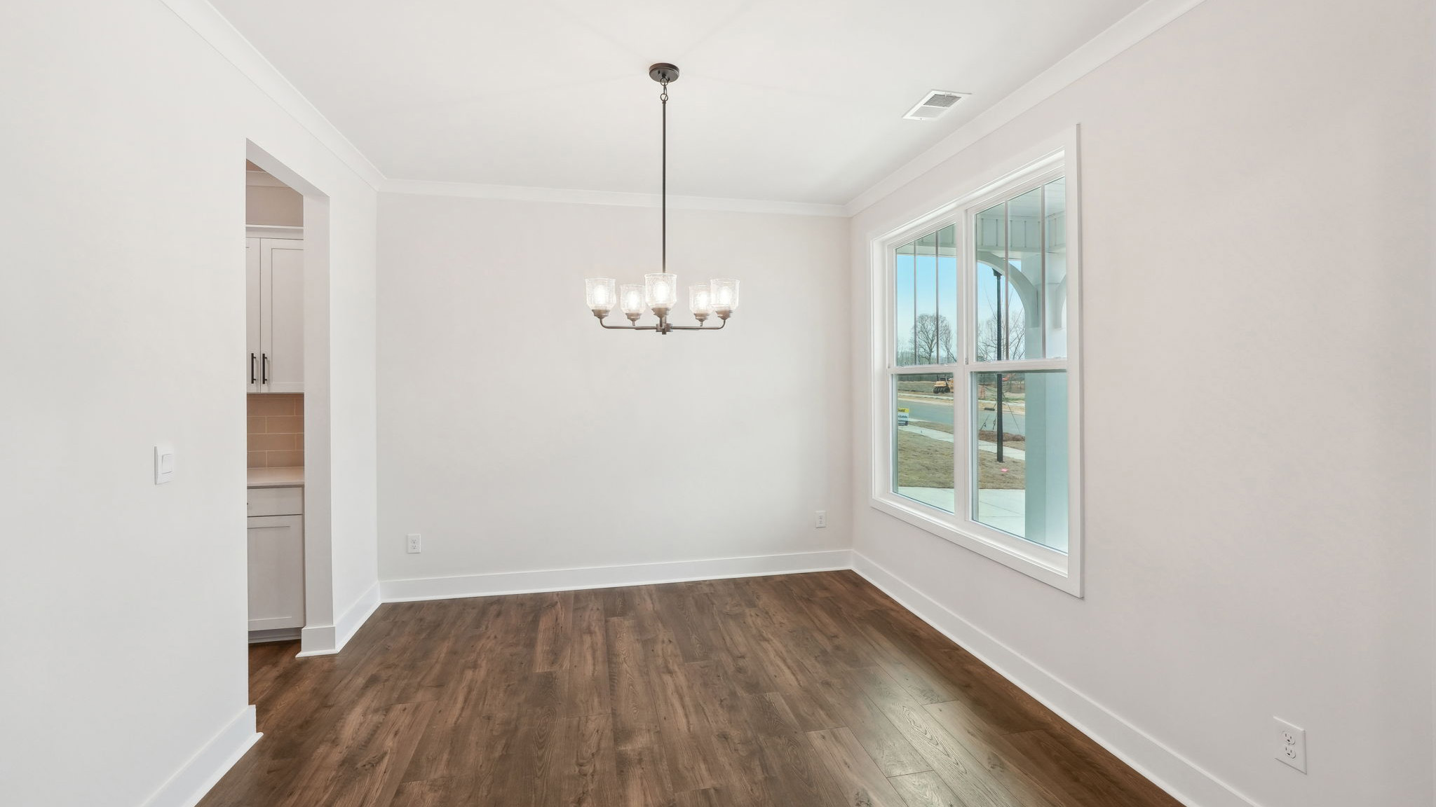 breakfast nook off of kitchen with glass sliding back doo
