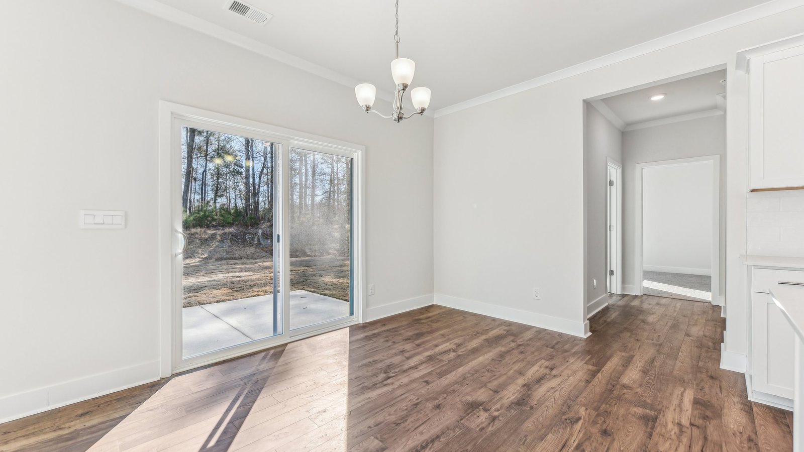 breakfast nook off of kitchen with glass sliding back doo