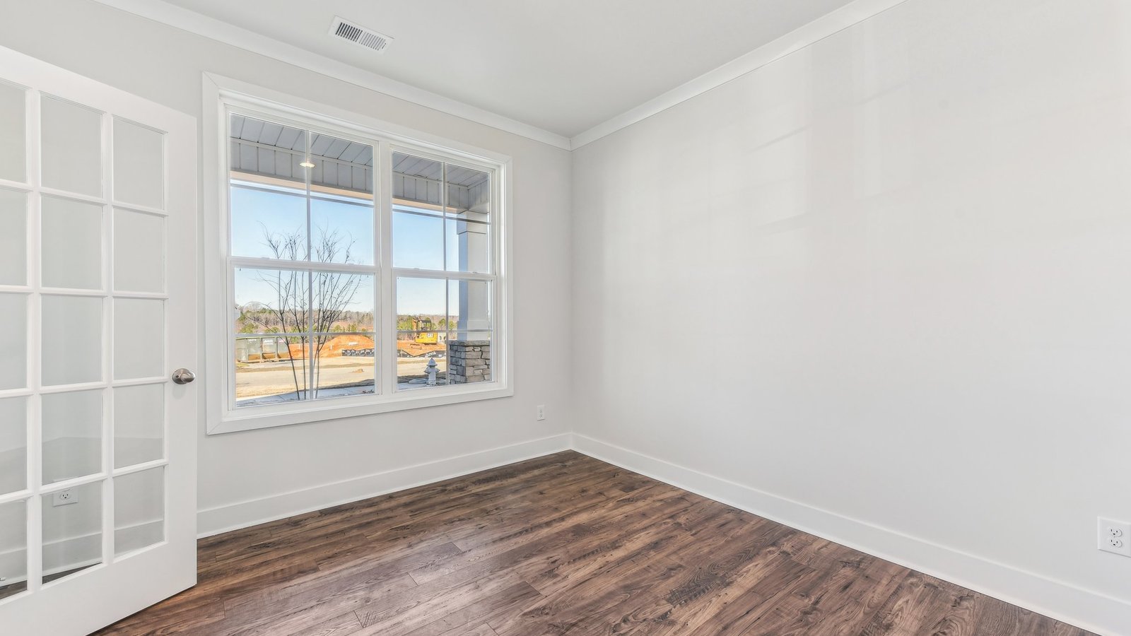 office flex space off of foyer with large window and french doors