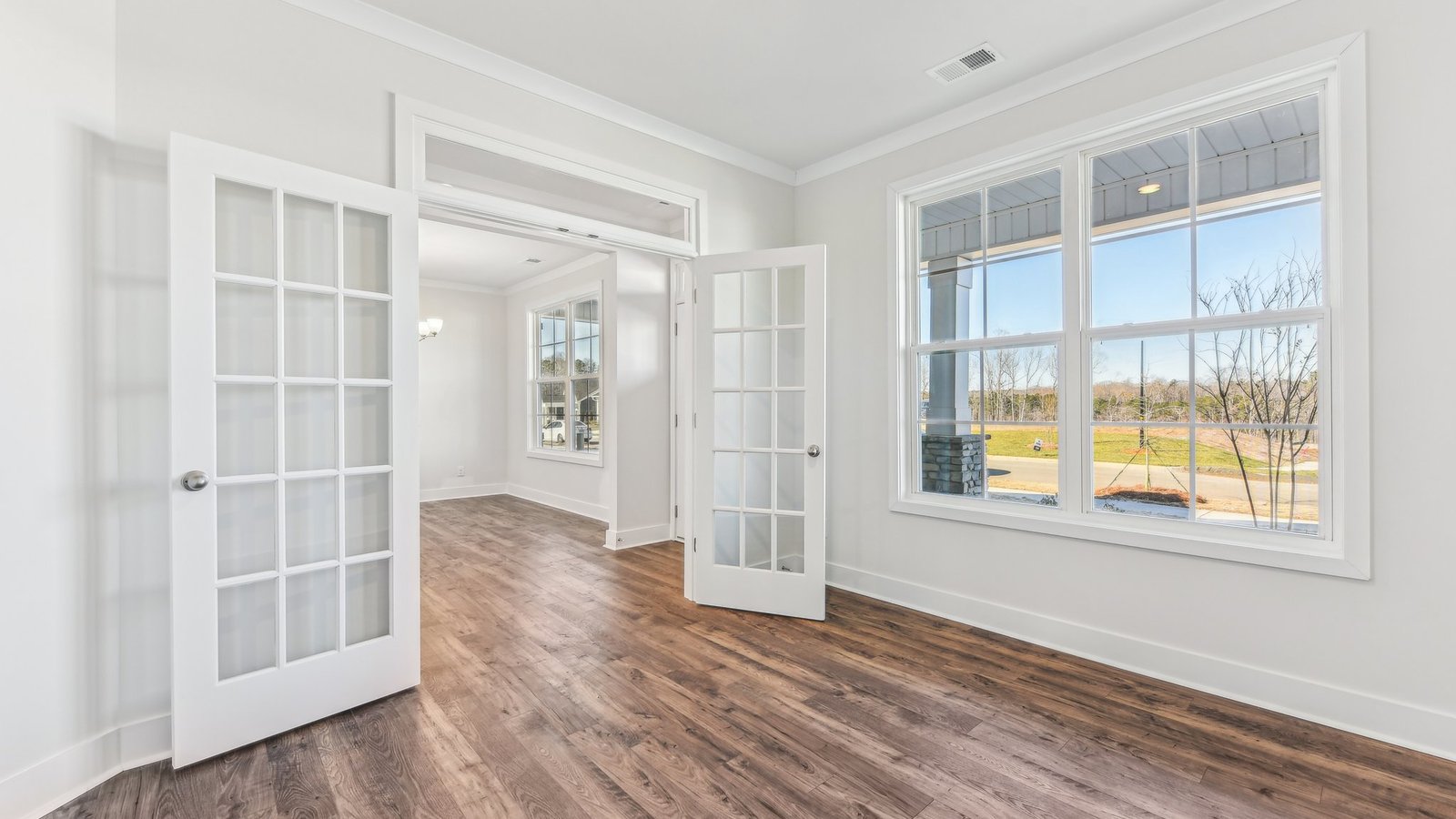office flex space off of foyer with large window and french doors