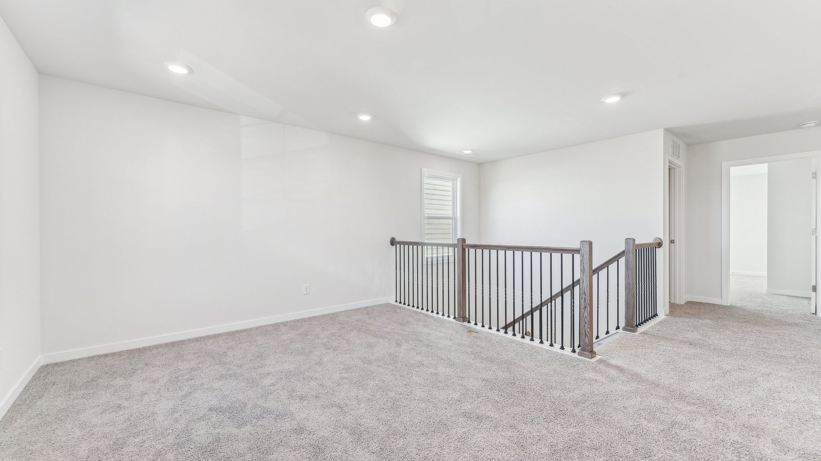 upstairs carpeted loft area