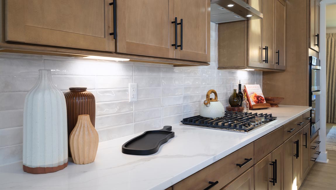 Kitchen and island, white counters and cabinets