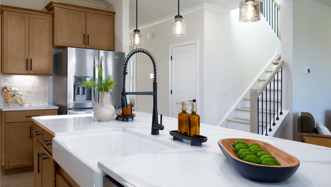 Kitchen and island, white counters and cabinets