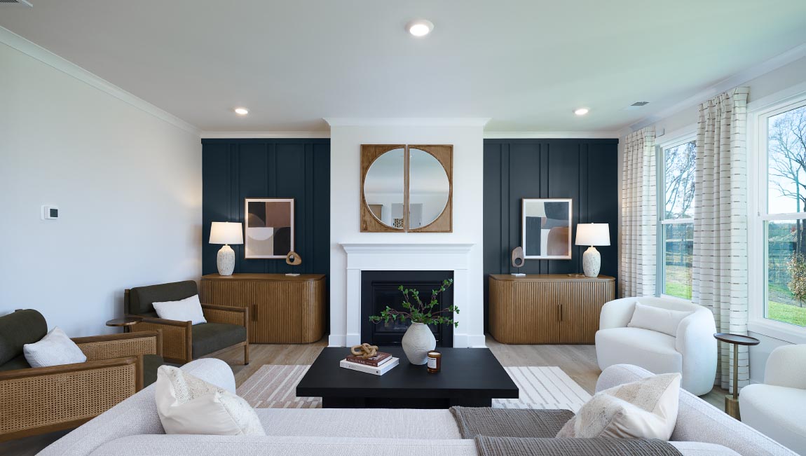 Open family room with three small windows and fireplace