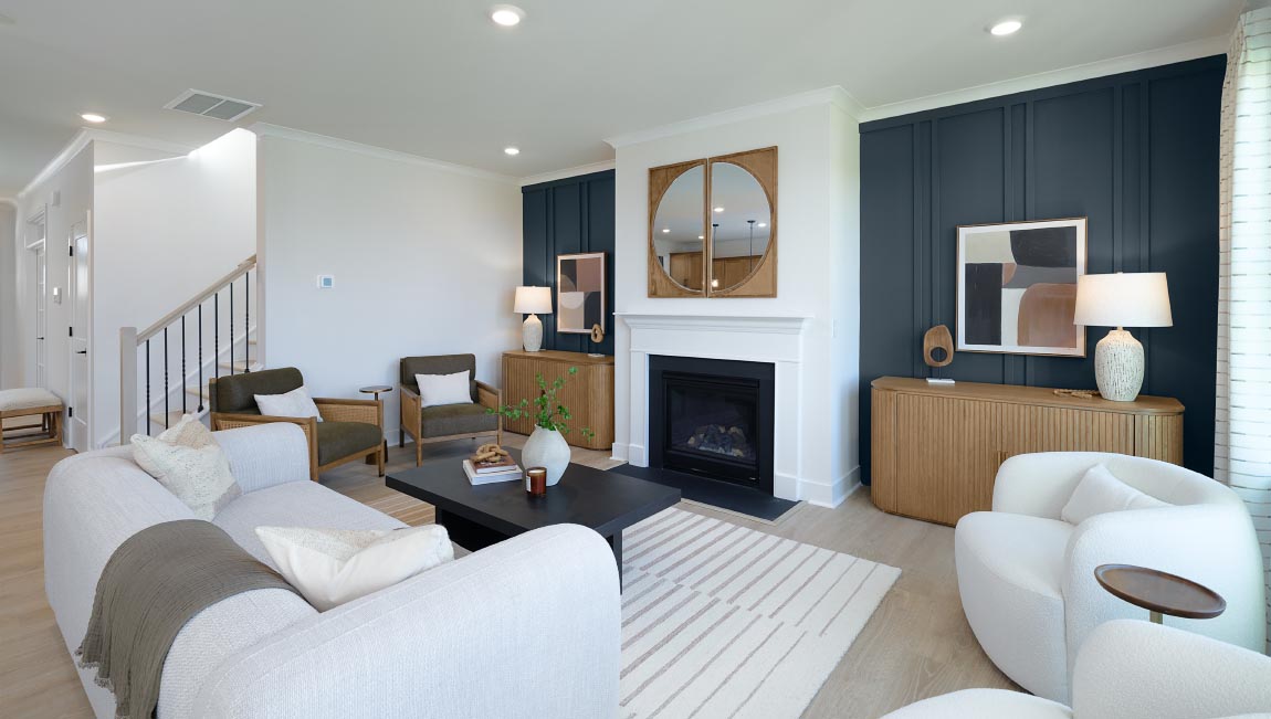 Open family room with three small windows and fireplace