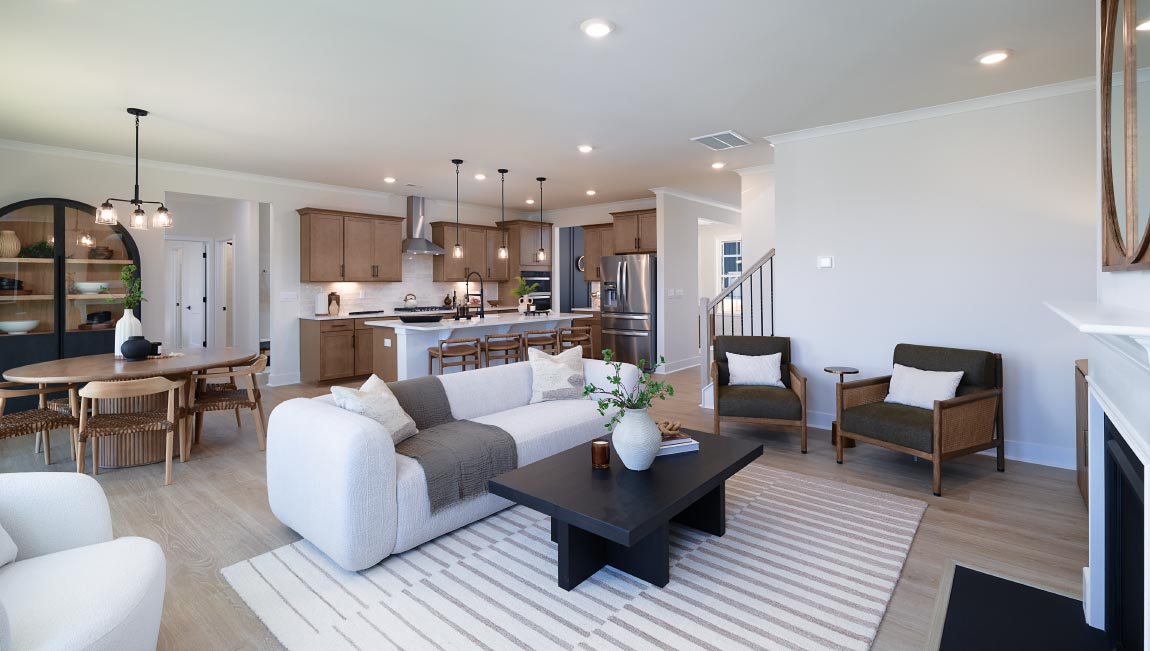 Open family room with three small windows and fireplace