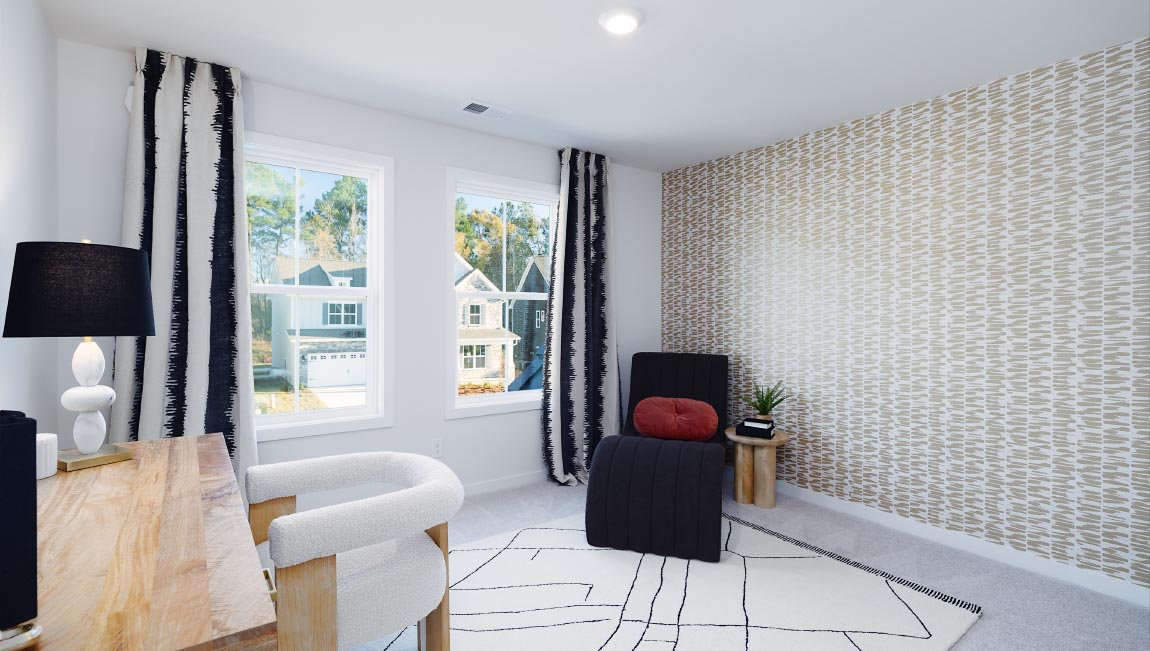Large carpeted bedroom with three windows