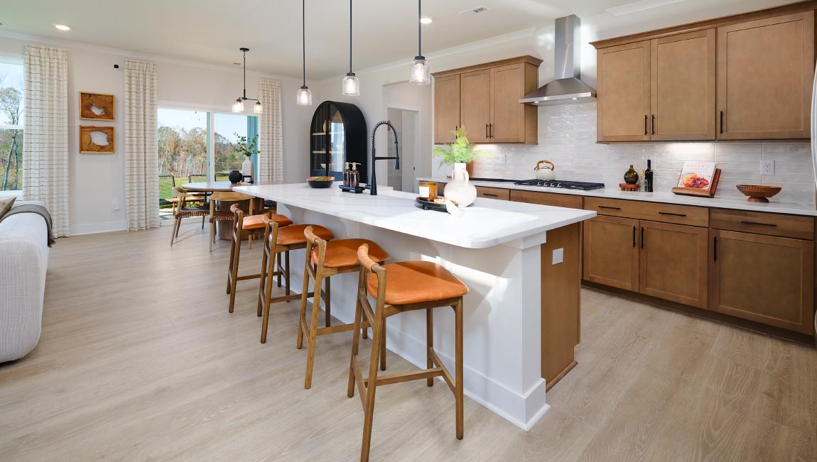 Kitchen and island, white counters and cabinets