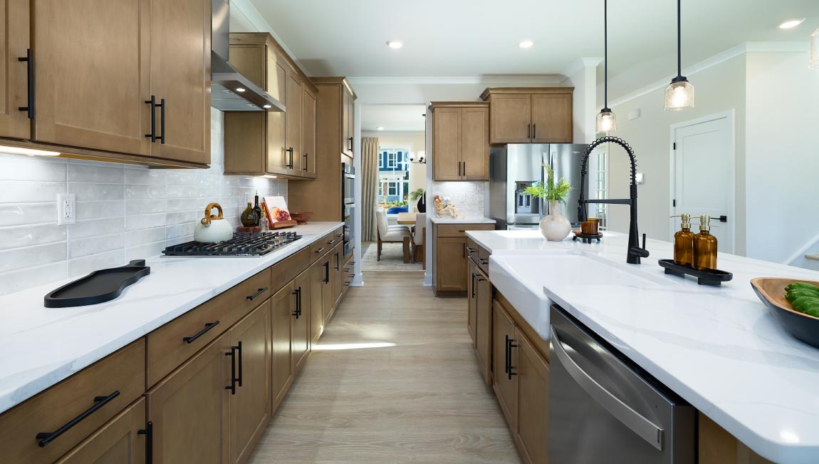 Kitchen and island, white counters and cabinets