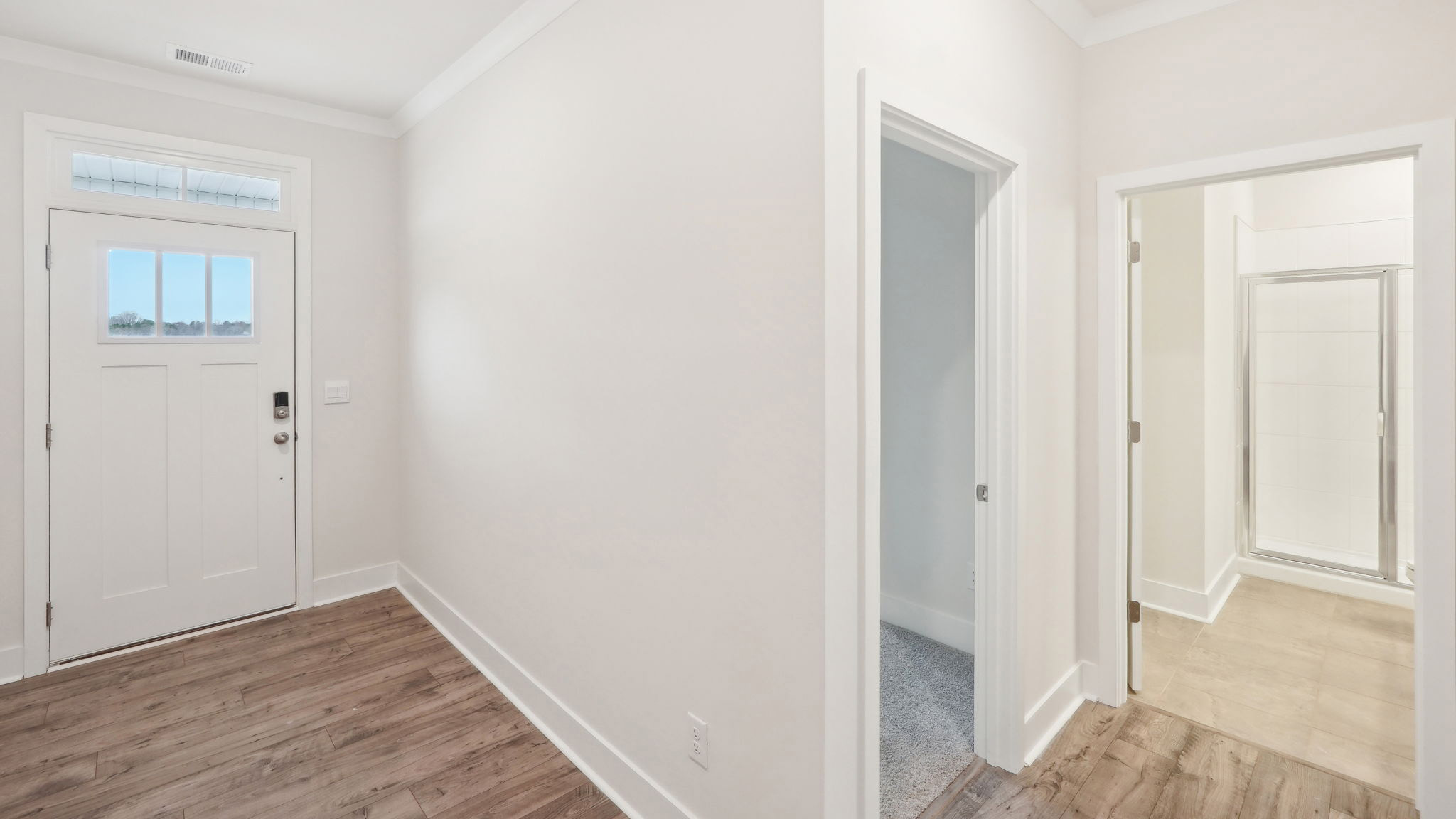 Welcoming foyer with view of stairs
