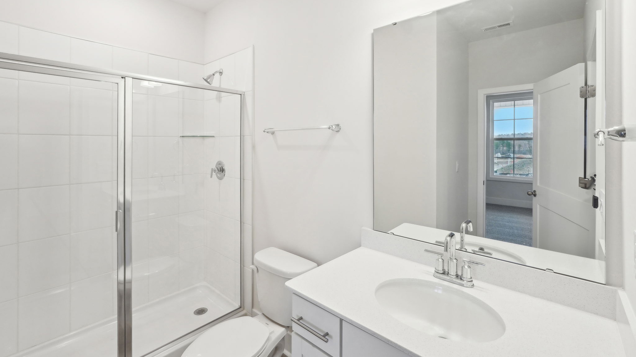 bathroom with standing glass shower