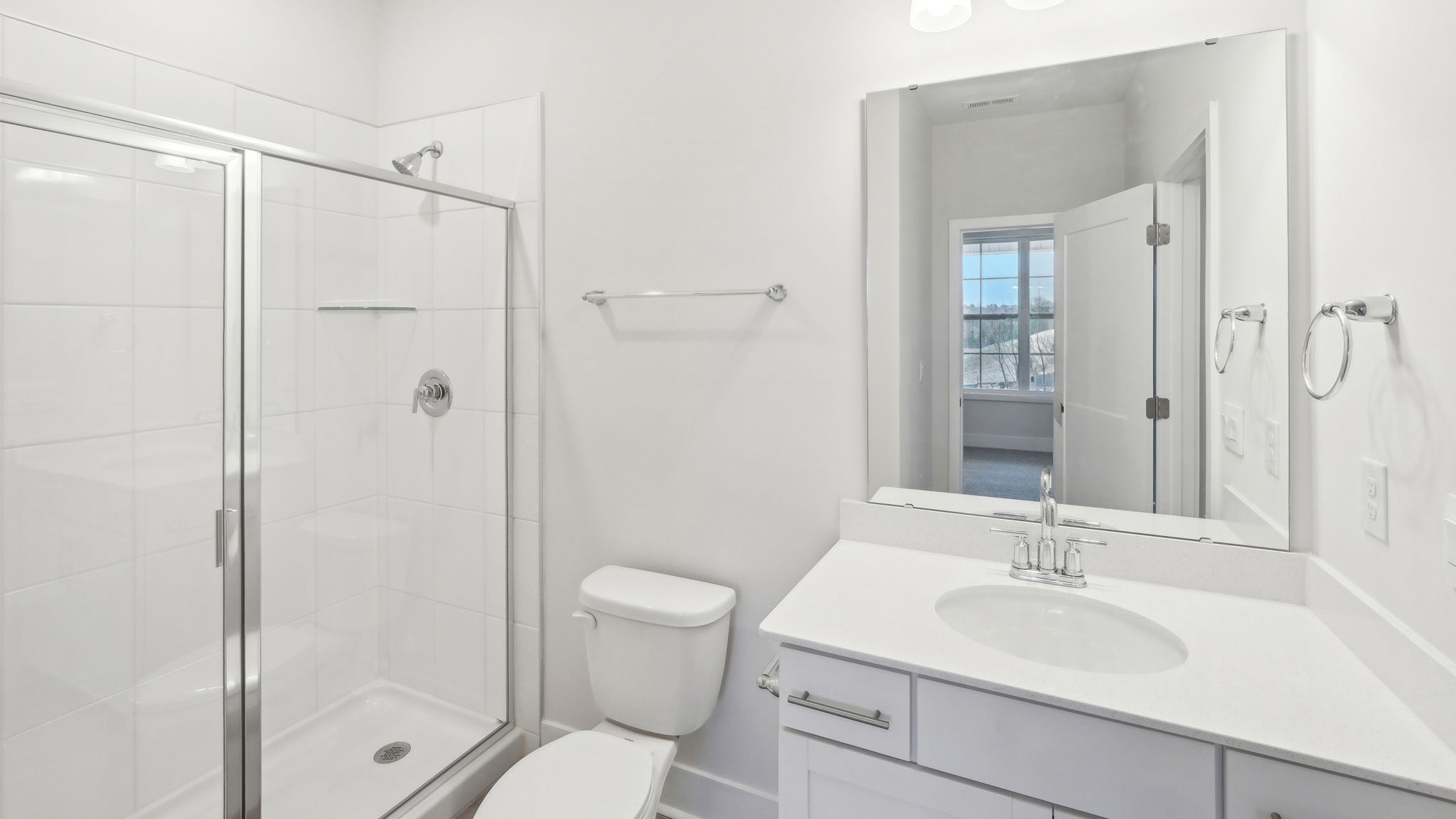 Bathroom with standing glass shower