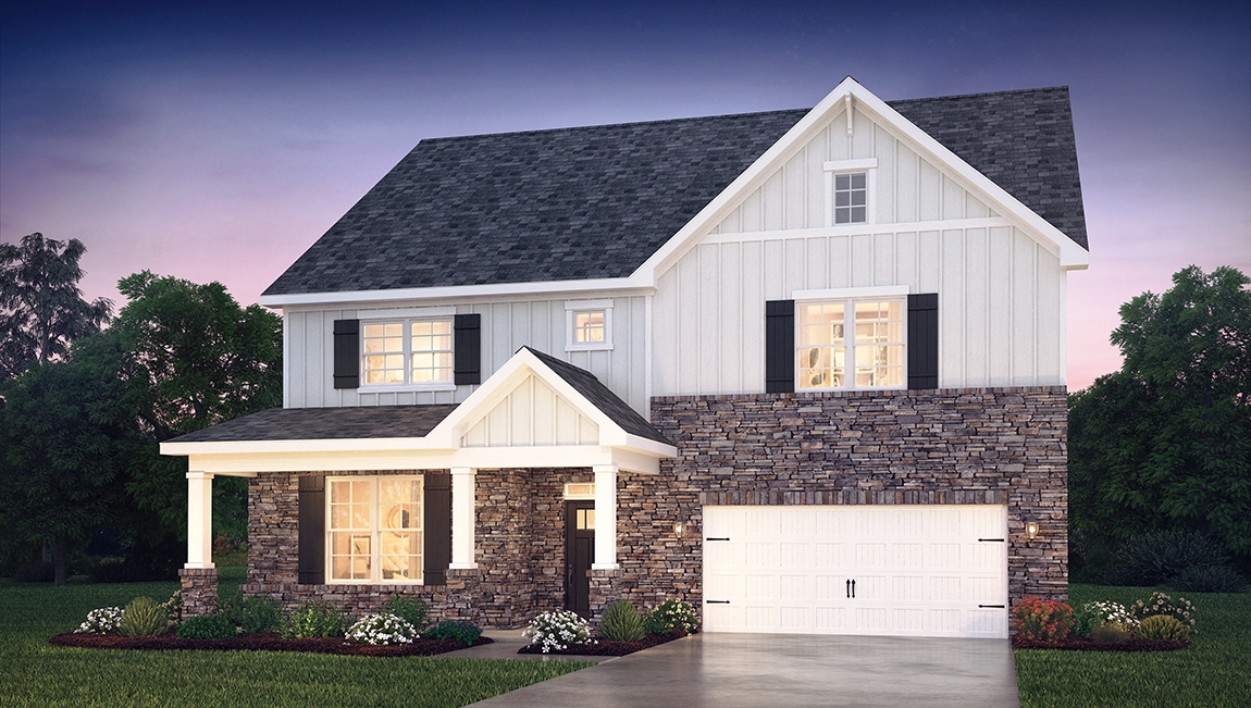 Wylie front exterior with beige siding, stone and two car garage