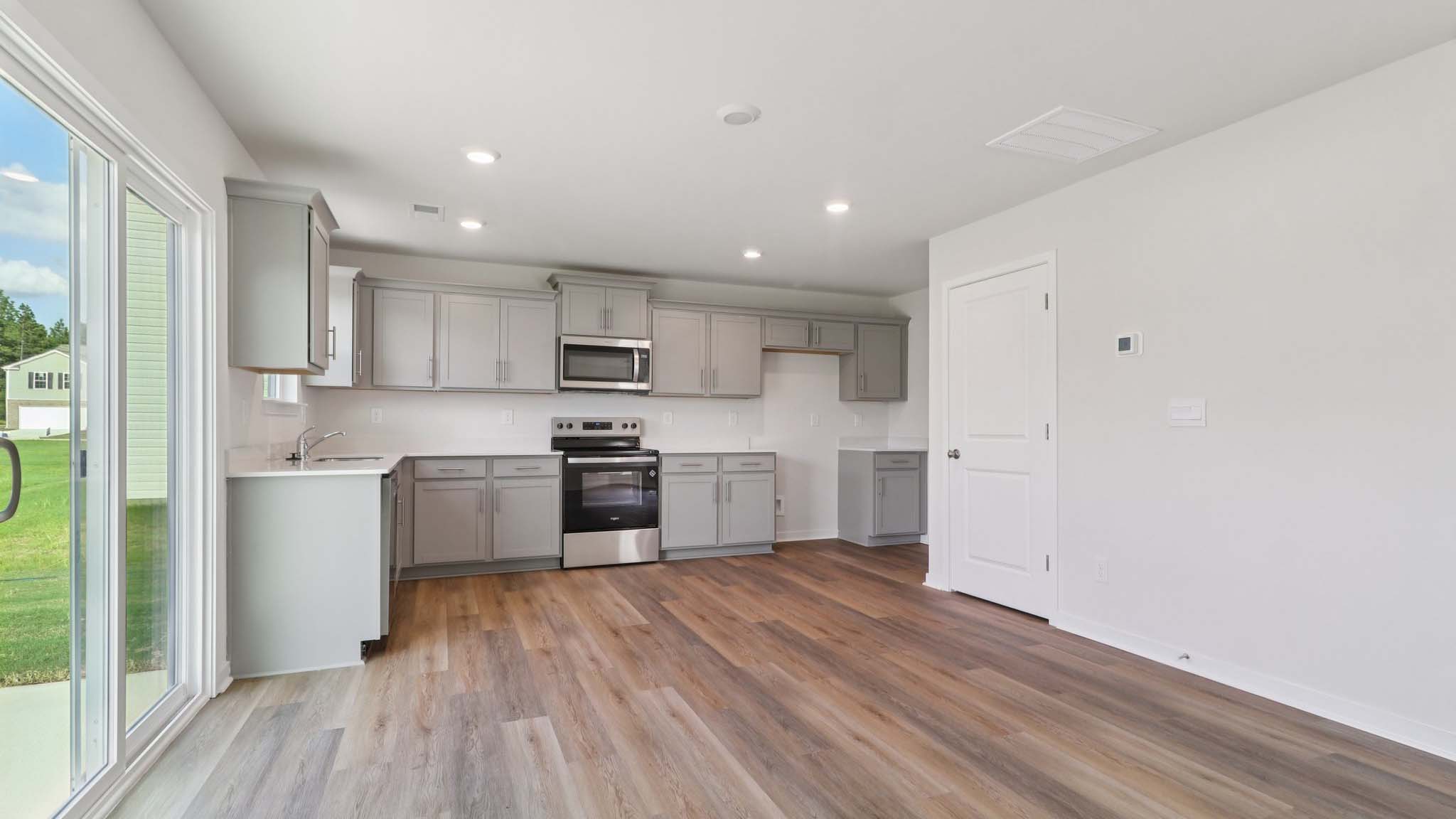 Large kitchen with stainless steel appliances