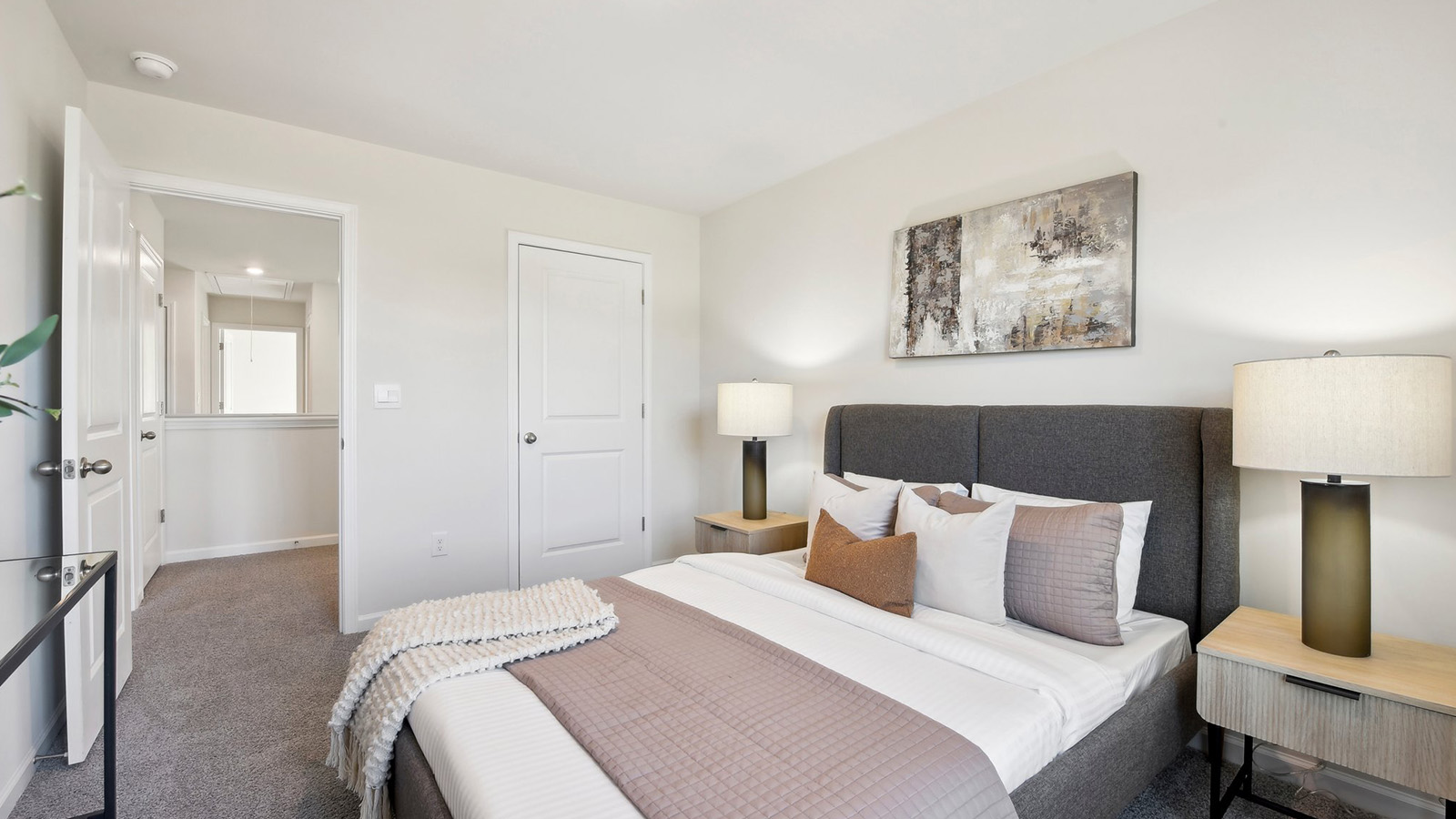 Carpeted bedroom with large windows