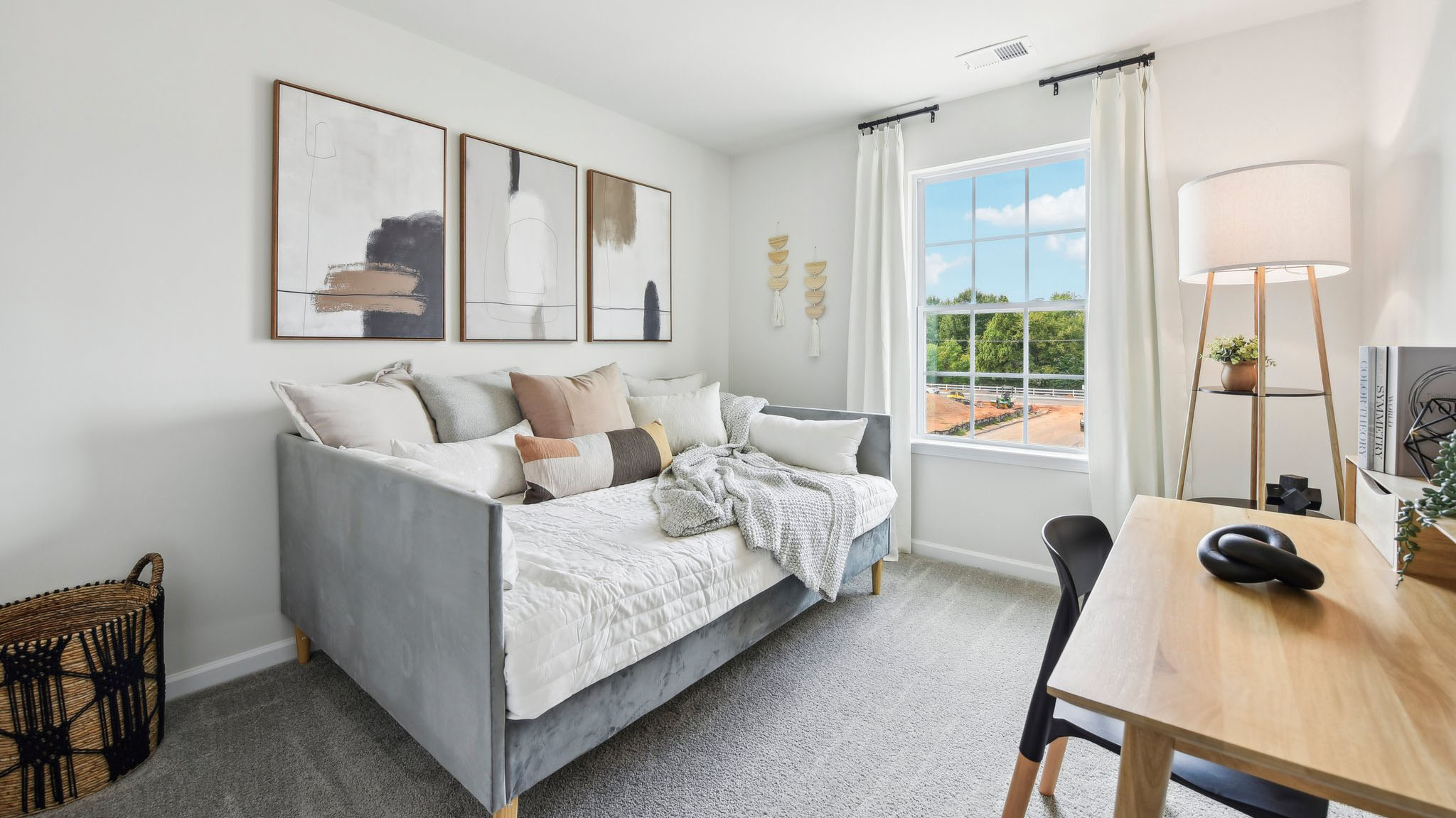 Carpeted bedroom with large windows