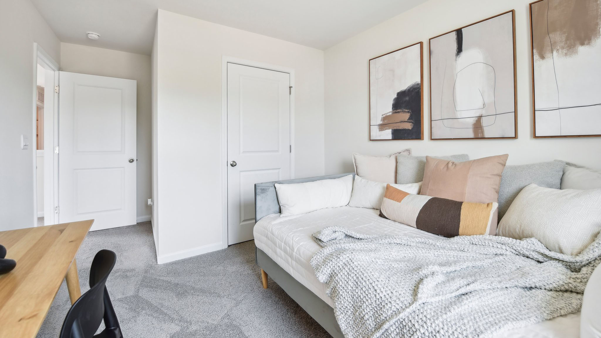Carpeted bedroom with large windows