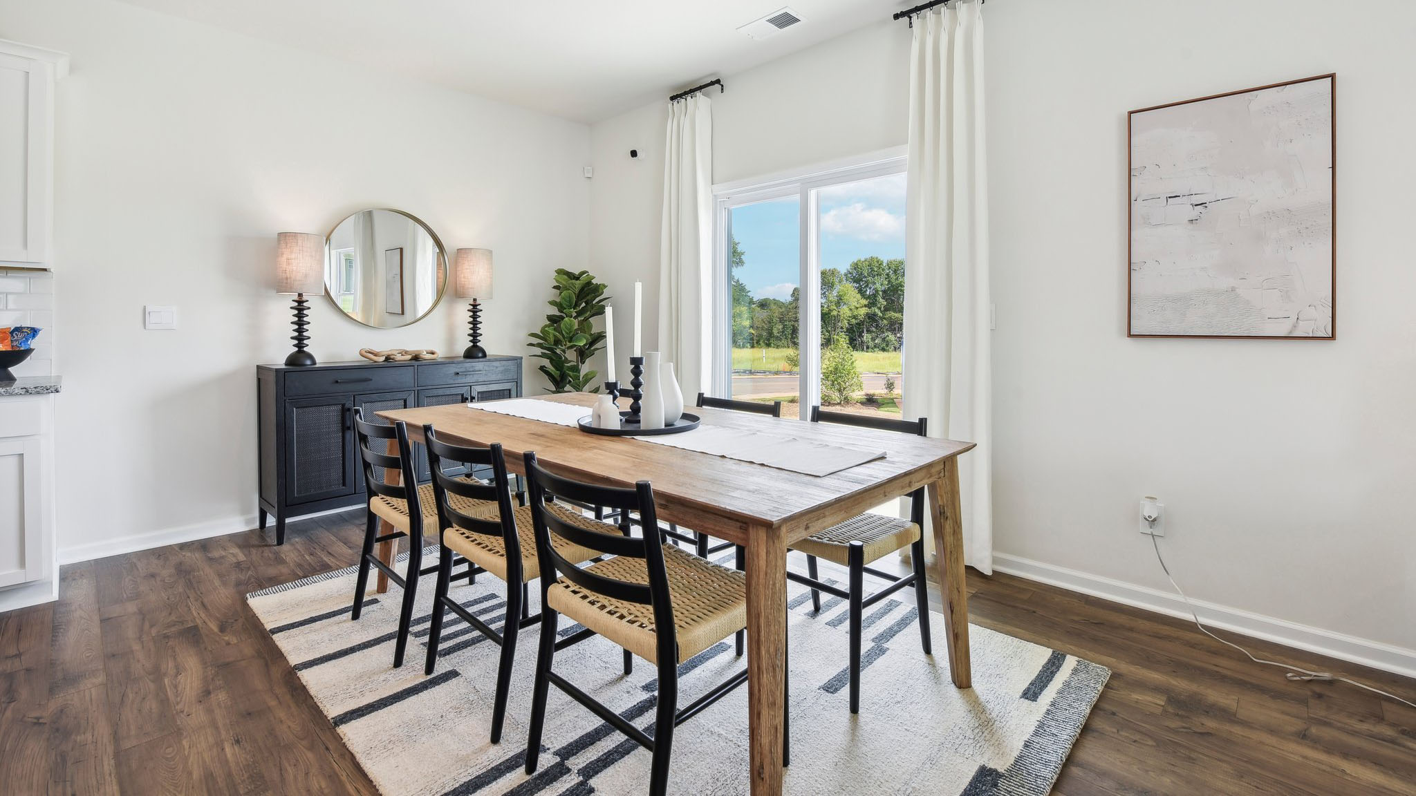 Kitchen and island, white cabinets, wood floors