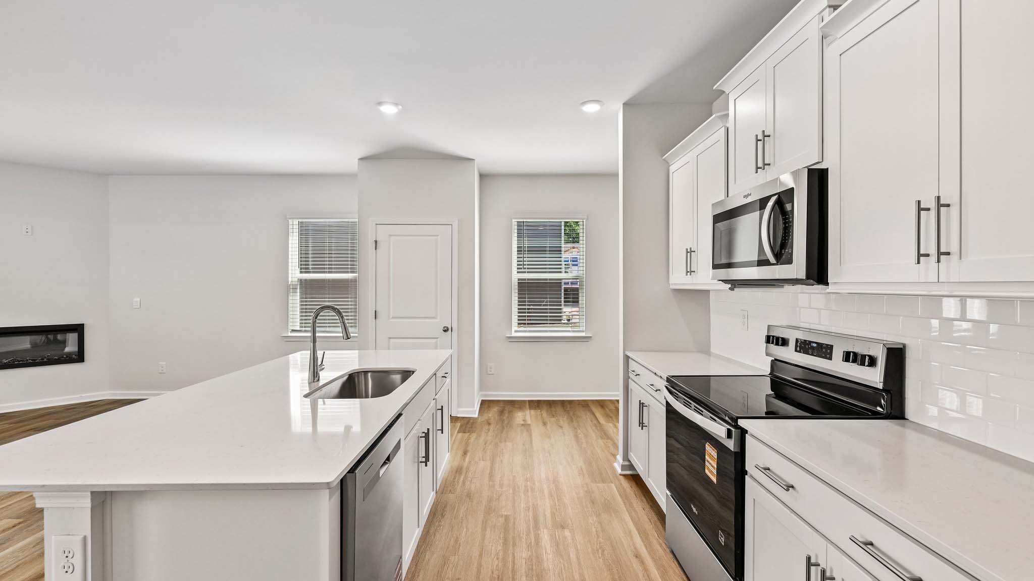 kitchen and island with stainless steel appliances