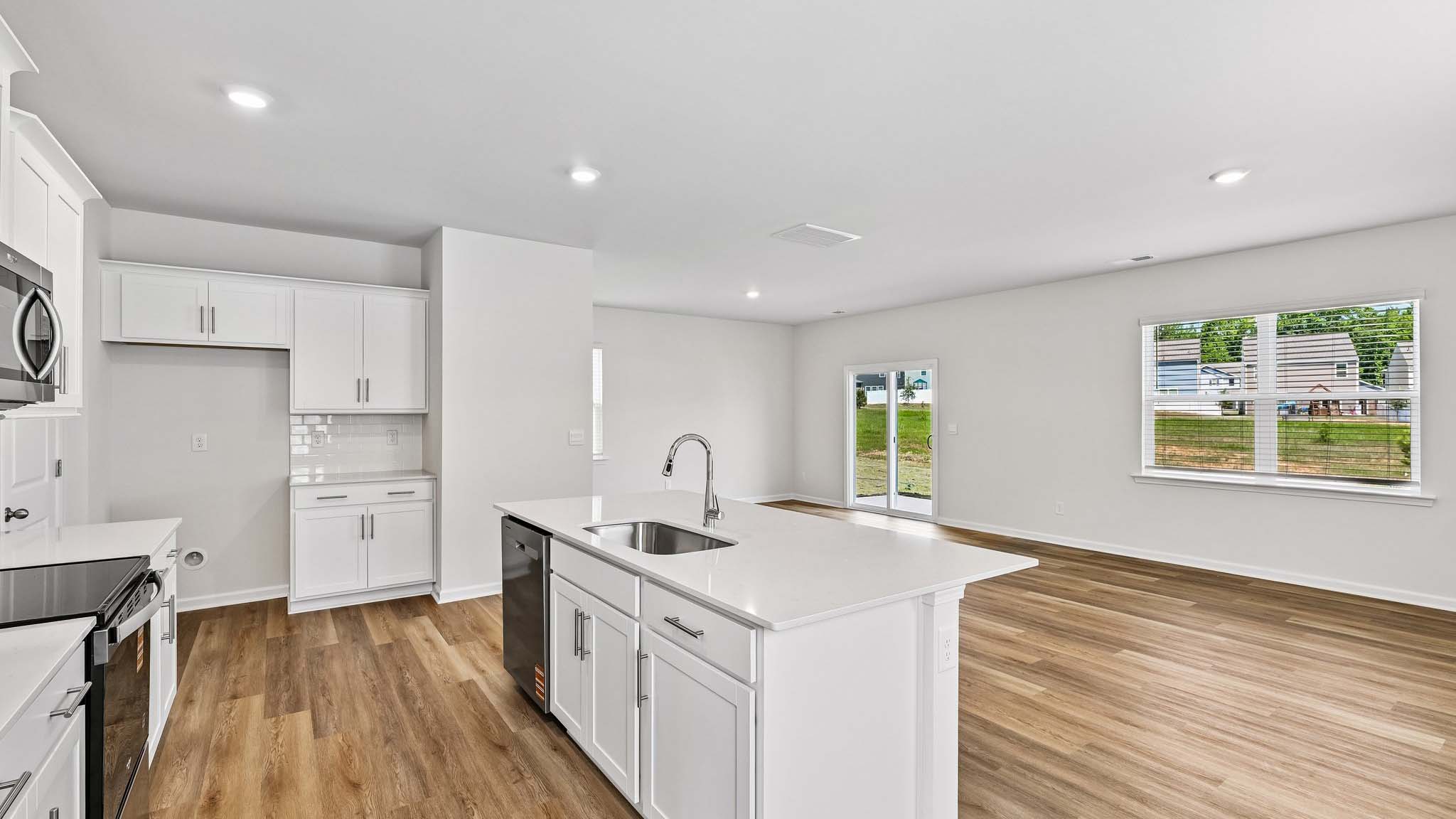 kitchen and island with stainless steel appliances