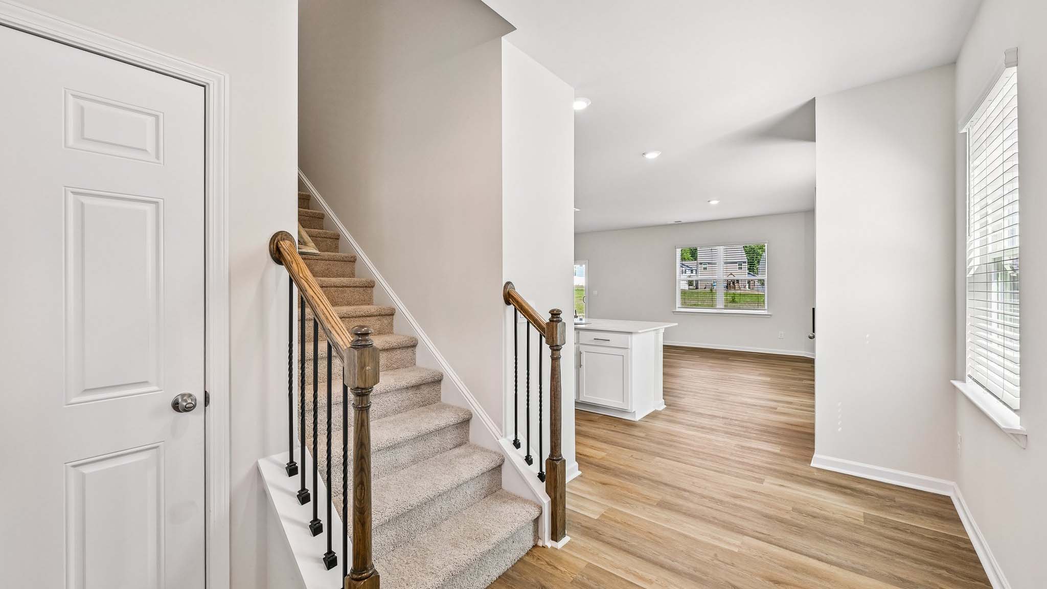 welcoming foyer with staircase