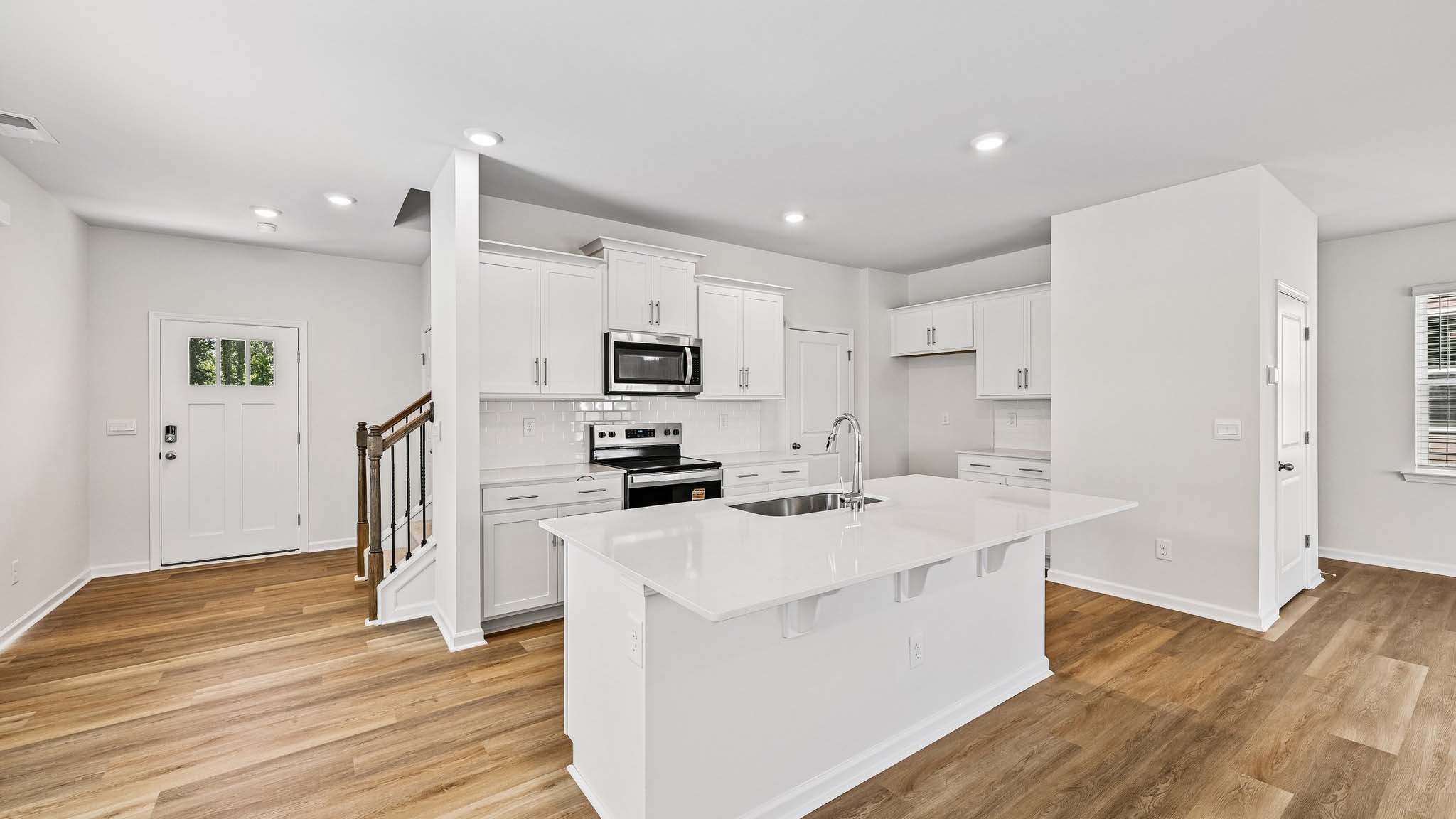kitchen and island with stainless steel appliances