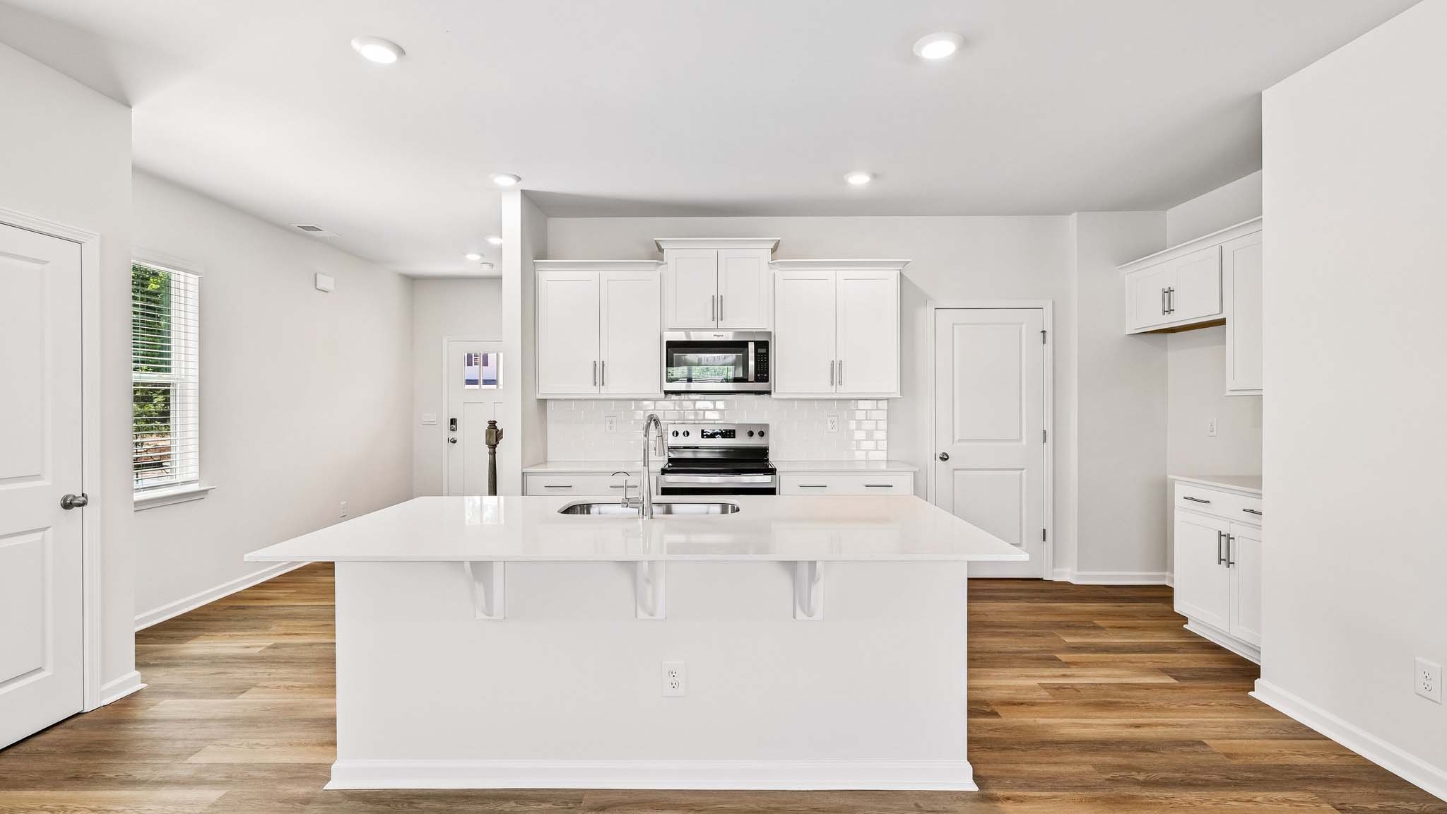 kitchen and island with stainless steel appliances