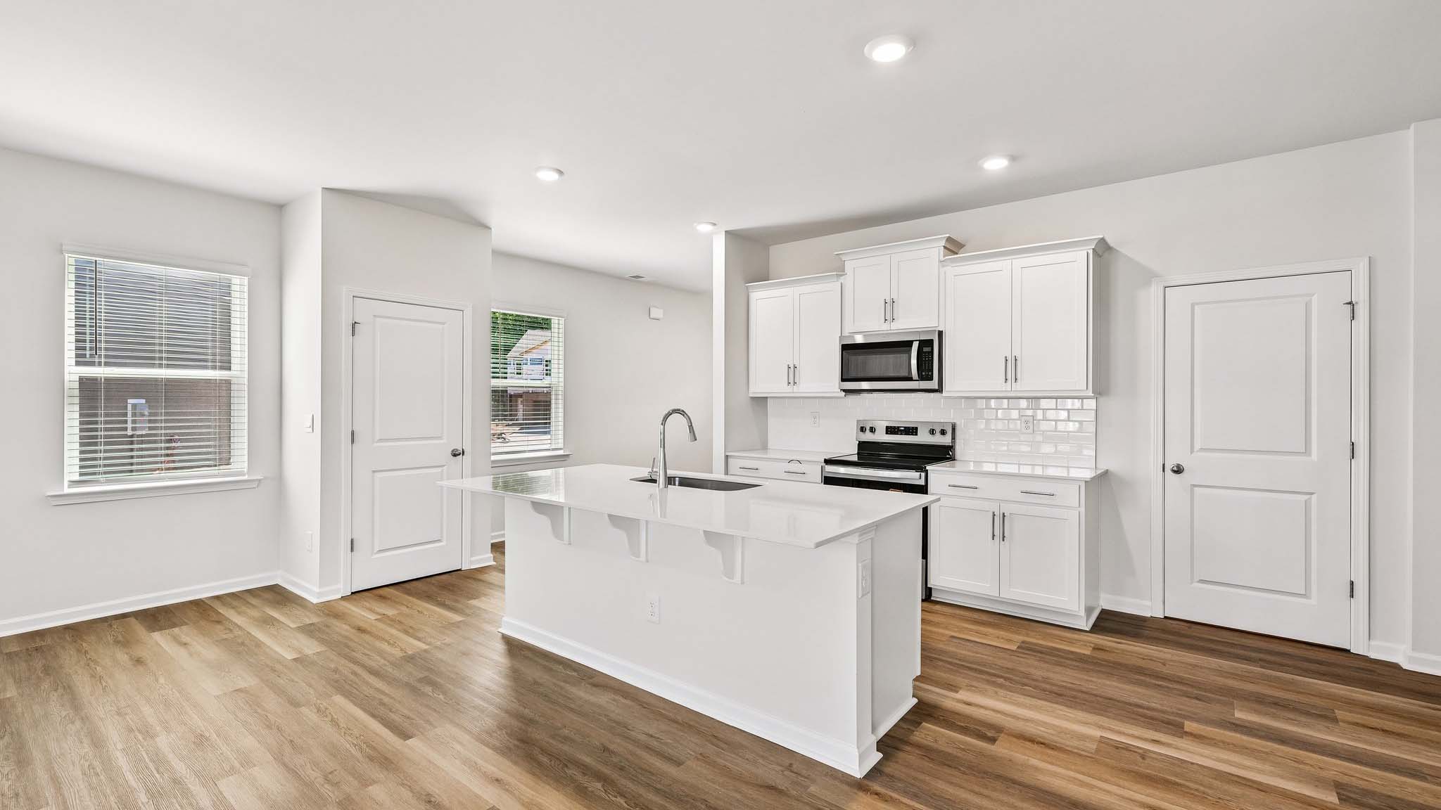 kitchen and island with stainless steel appliances