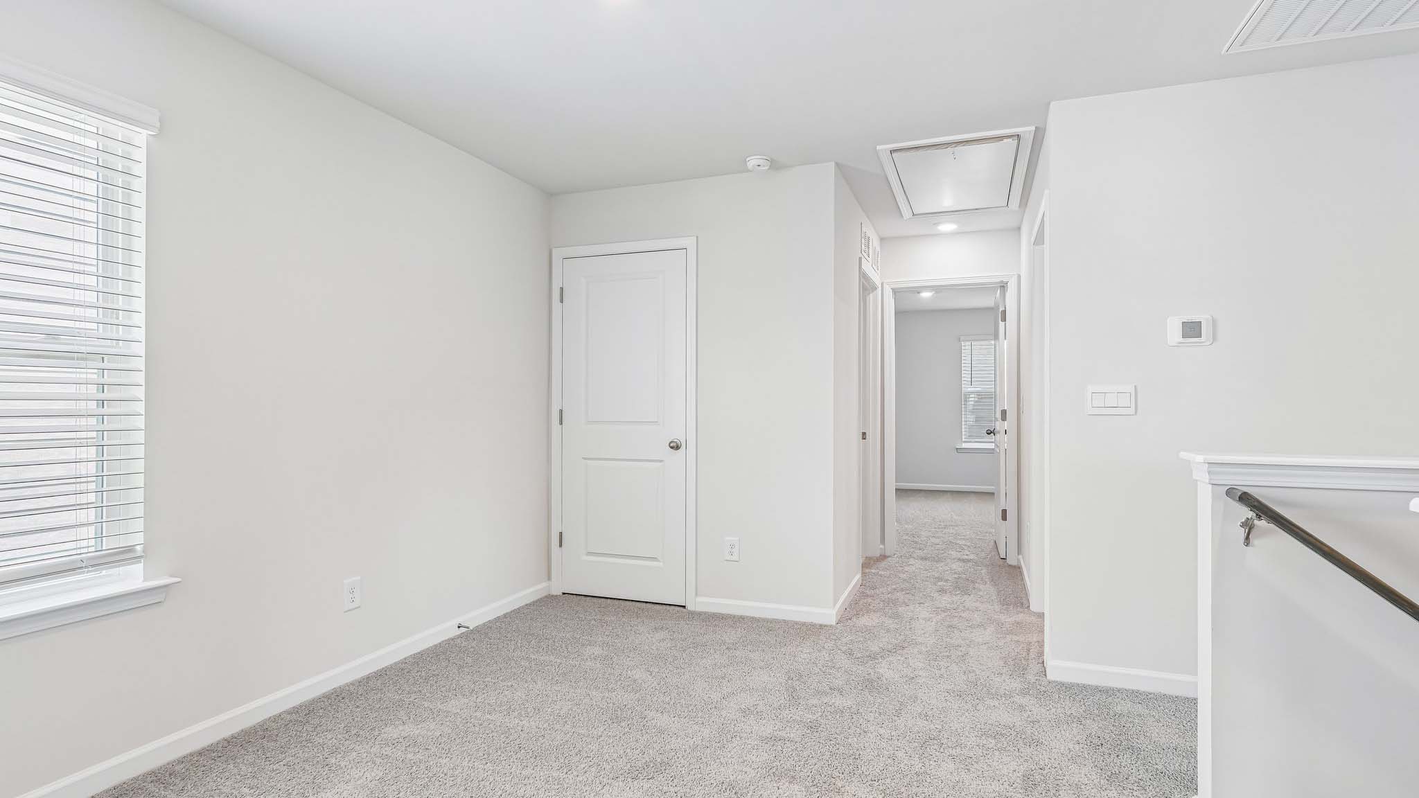 carpeted upstairs loft