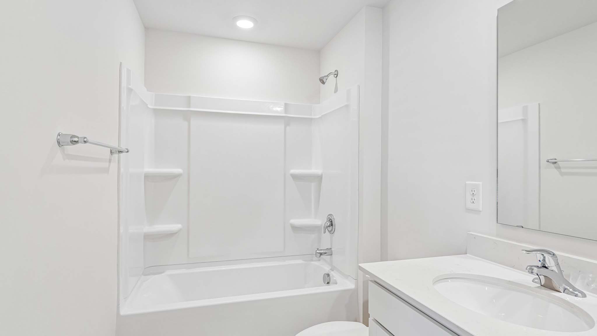bathroom with bathtub shower combination