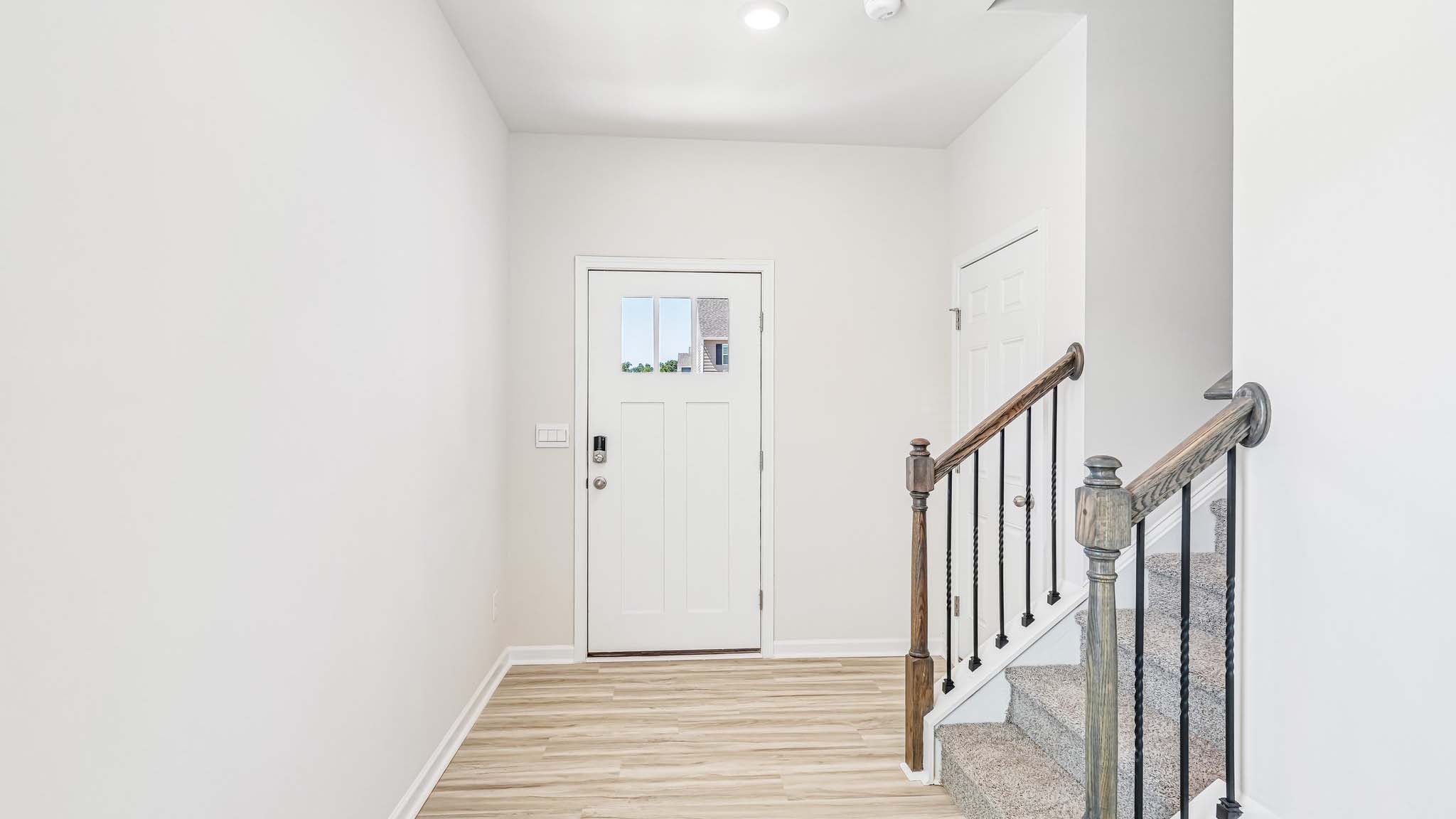 welcoming foyer with staircase