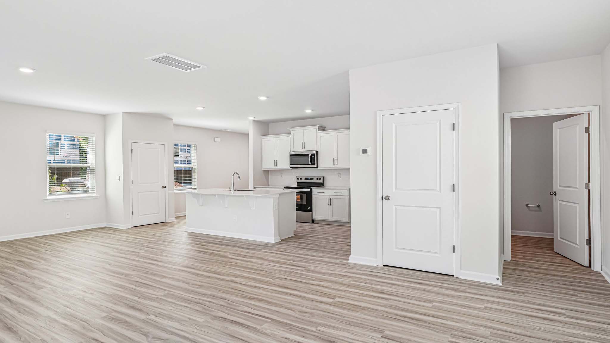kitchen and island with stainless steel appliances
