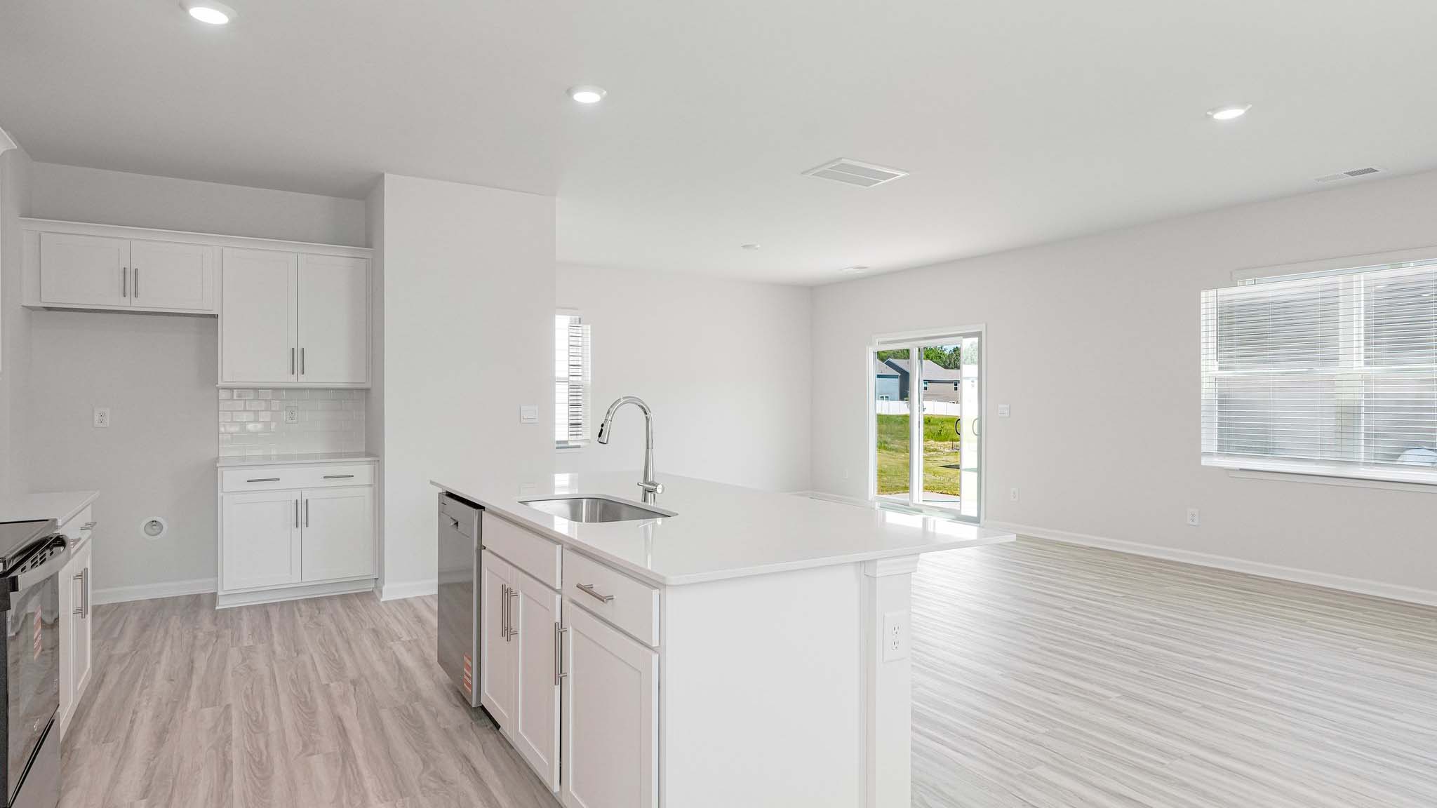 kitchen and island with stainless steel appliances