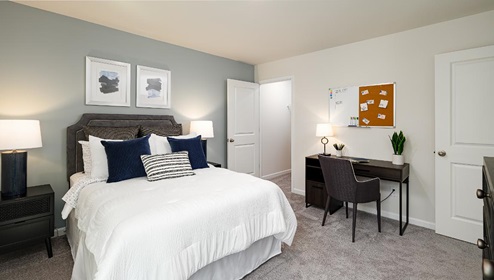 Fergus Crossing Penwell Model carpeted bedroom with large window