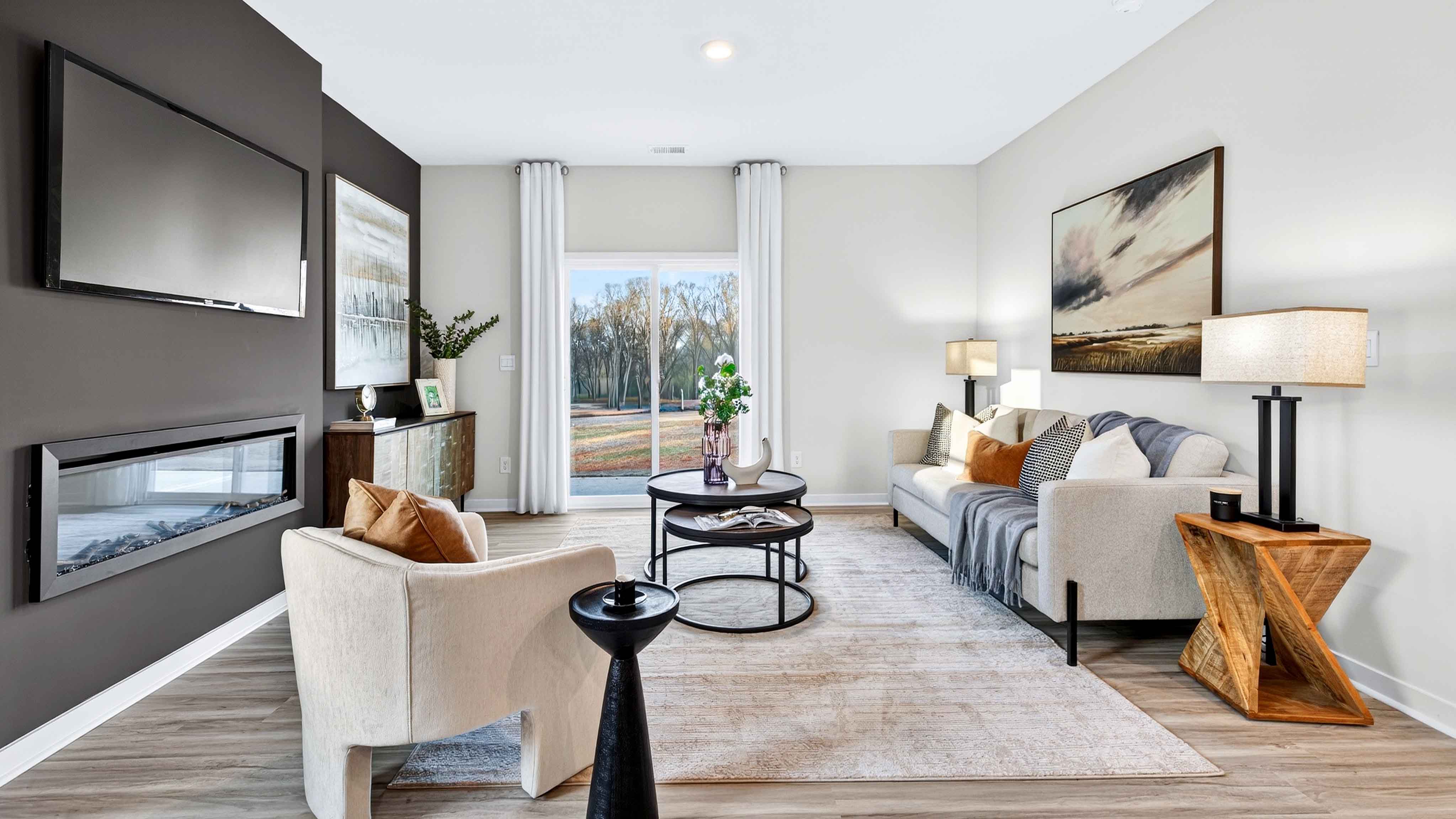 Family room with fireplace and large window