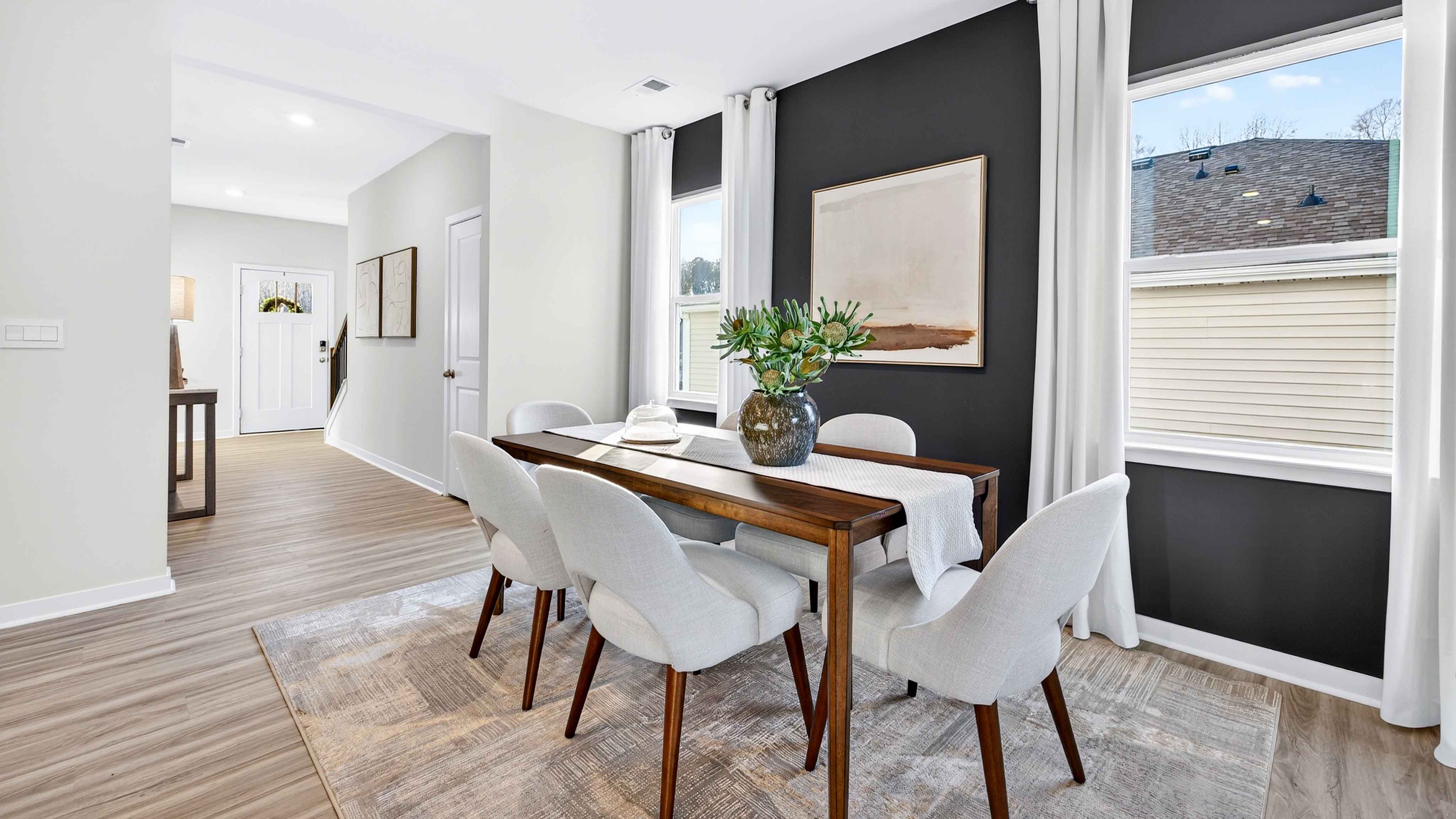 Dining Room in view of family room, wood floors, two windows alongside