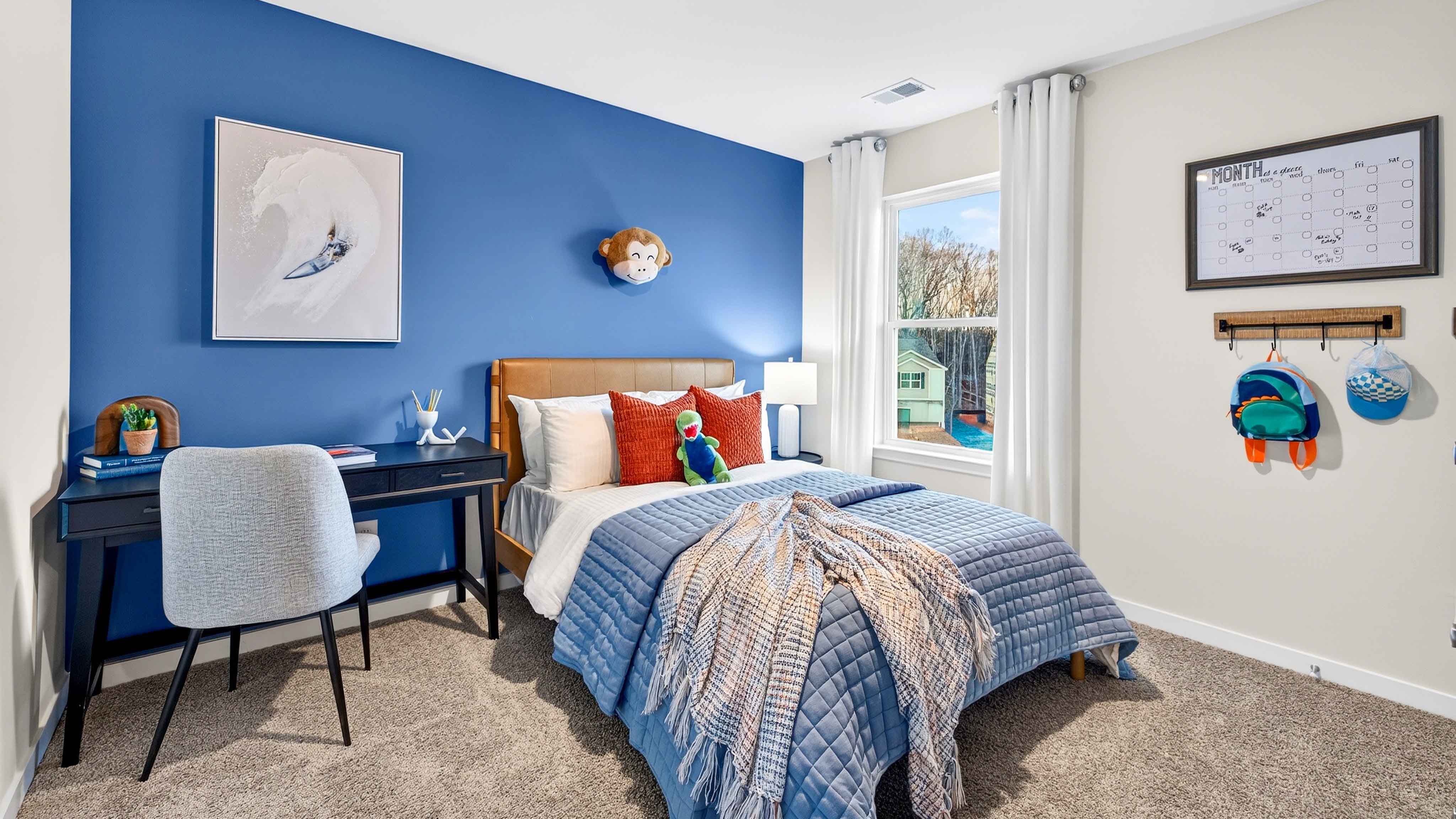 Carpeted bedroom with large window