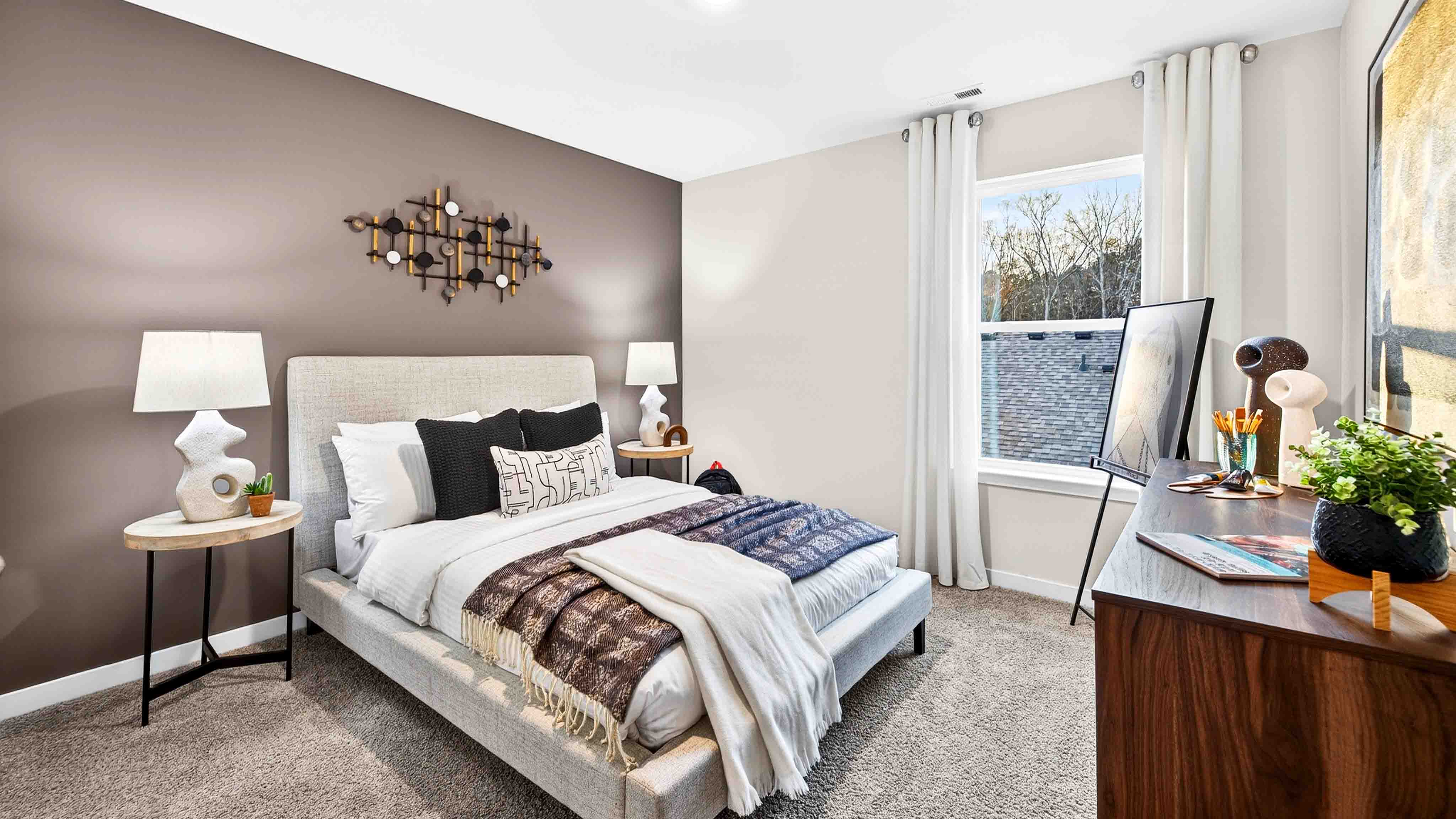 Carpeted bedroom with large window