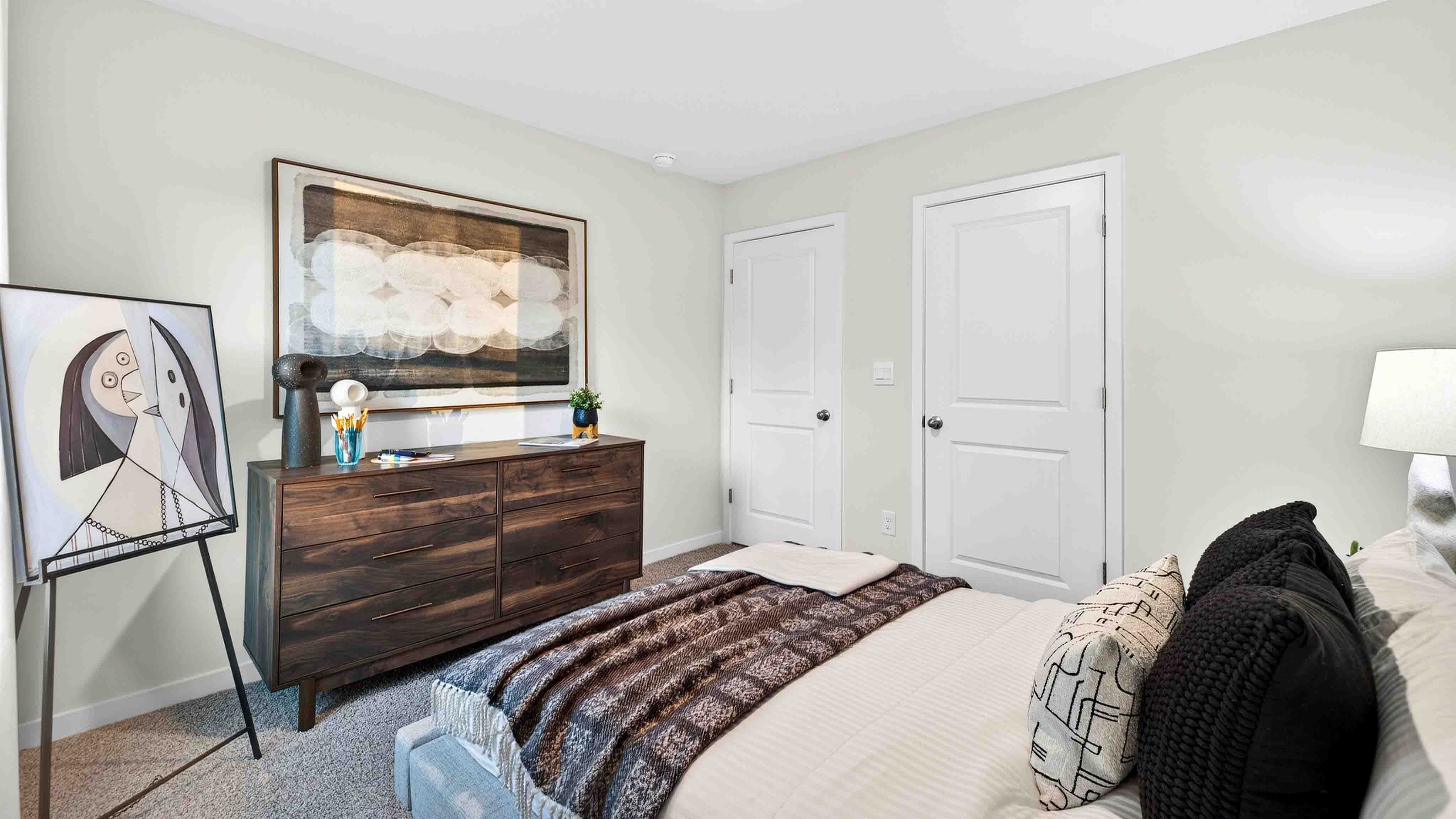 Carpeted bedroom with large window