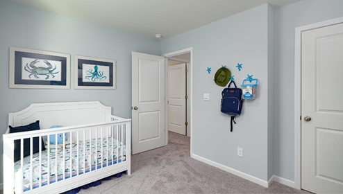Fergus Crossing Penwell Model carpeted bedroom with large window