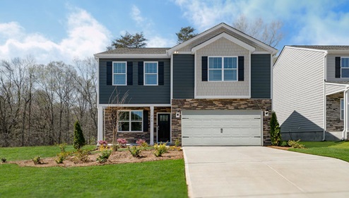 Fergus Crossing Penwell Model front exterior with blue siding, neutral toned stone, and two car garage